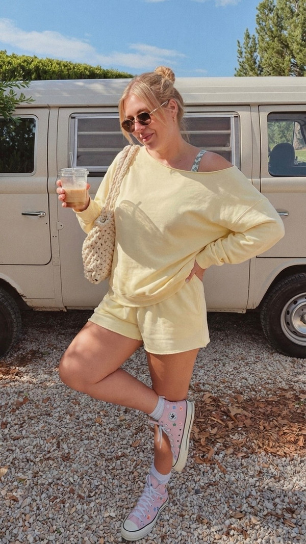 Aerie OFFLINE sky blue crossover biker shorts and sports bra set, school drop-off athleisure outfit spring 2026, styled with red Adidas Sambas and Yankees cap