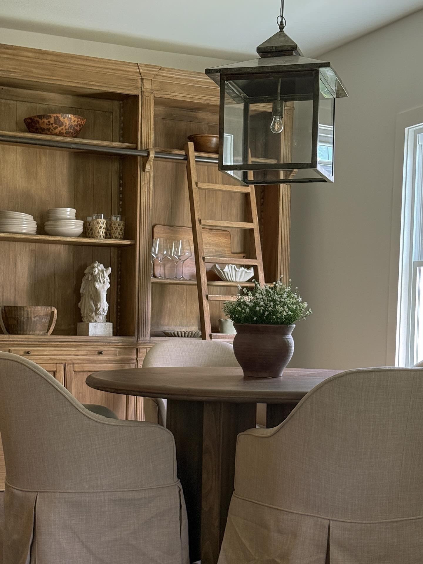 Our new dining room set up at the air bnb. Couldn't love this dining table & dining chair combo more!! And this lantern pendant really just brings the entire space together! #diningroom #diningroominspo

#LTKHome #LTKSaleAlert