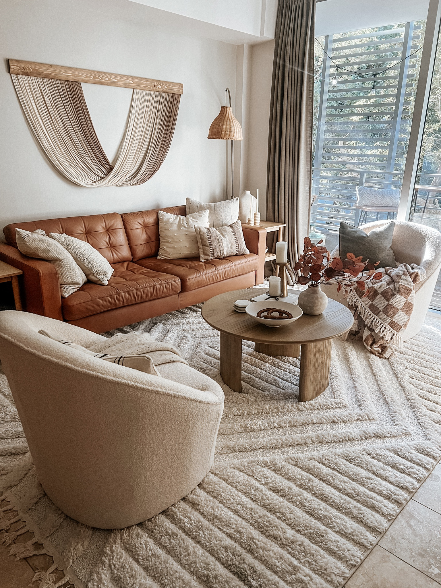 Neutral living room views 

Rug, accent chair, swivel chair, fiber art, neutral decor, boho decor, lamp, end table 

#LTKhome #LTKSeasonal