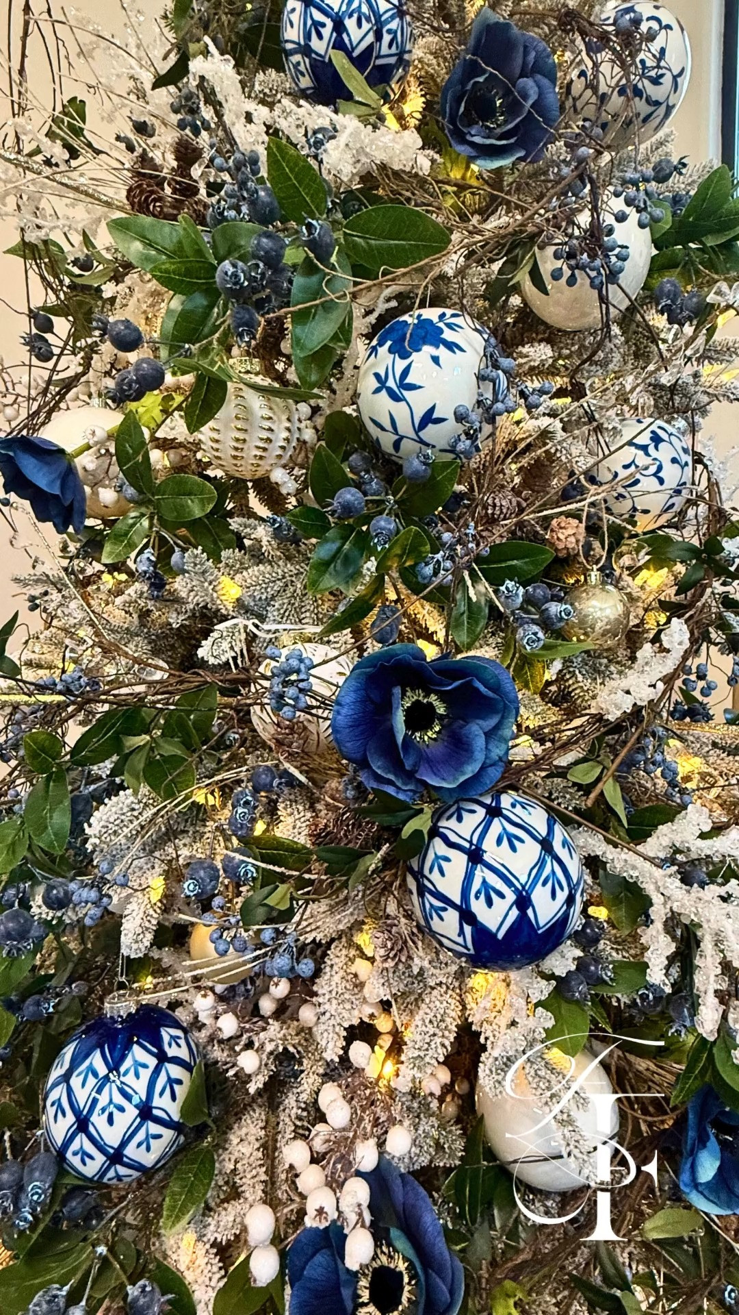 A dreamy blue-FAUX smocked Christmas tree 💙🎄 gorgeous chinoiserie blue ornaments, faux blue anemone flowers, frosted berry branches, icy twigs, and baby’s breath vines — it all comes together to create the sweetest, most magical holiday look. ❄️
 

 #LTKHoliday #LTKSeasonal #LTKHome