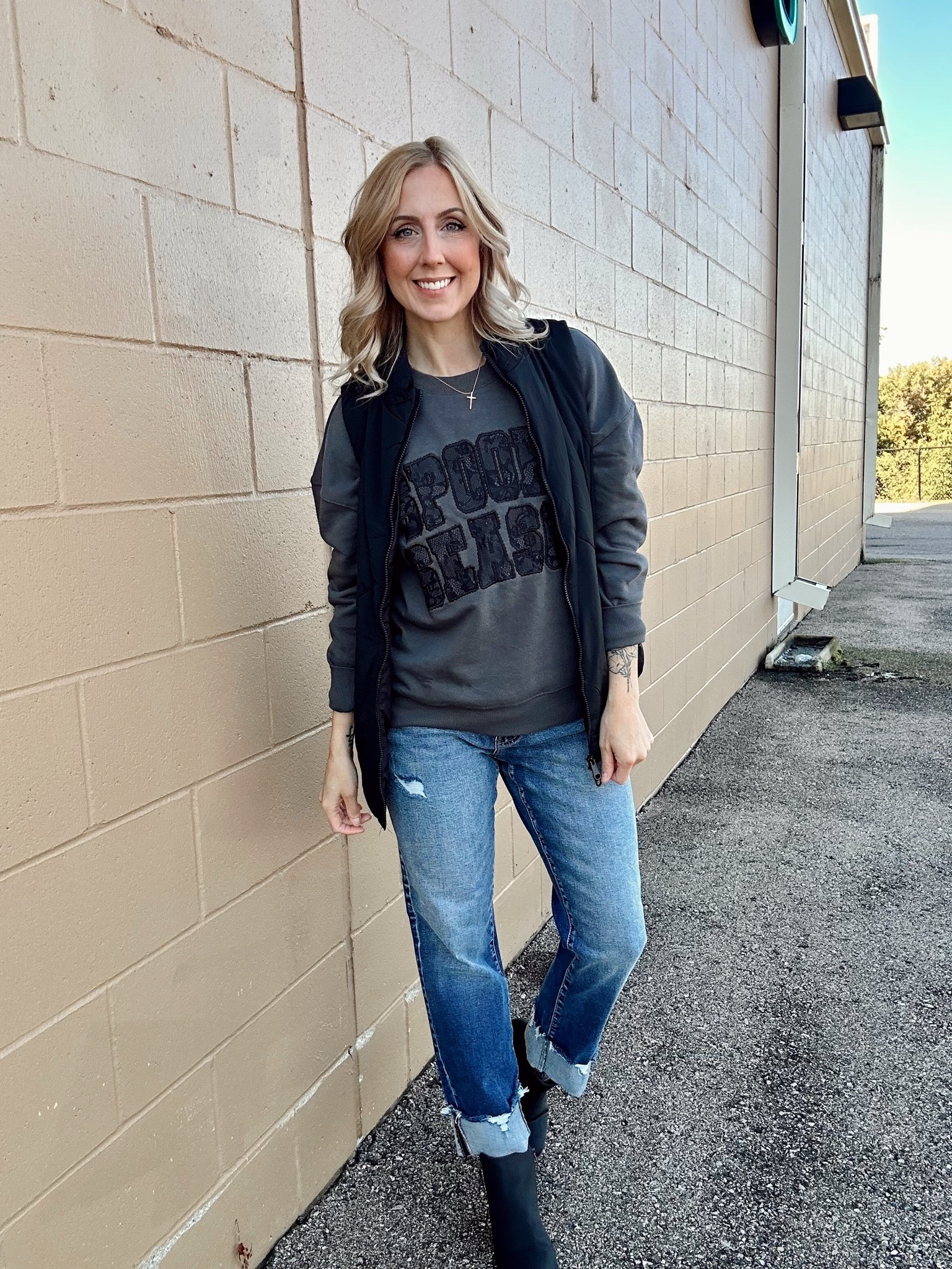 Wearing small in vest, medium in sweatshirt and 27 in jeans