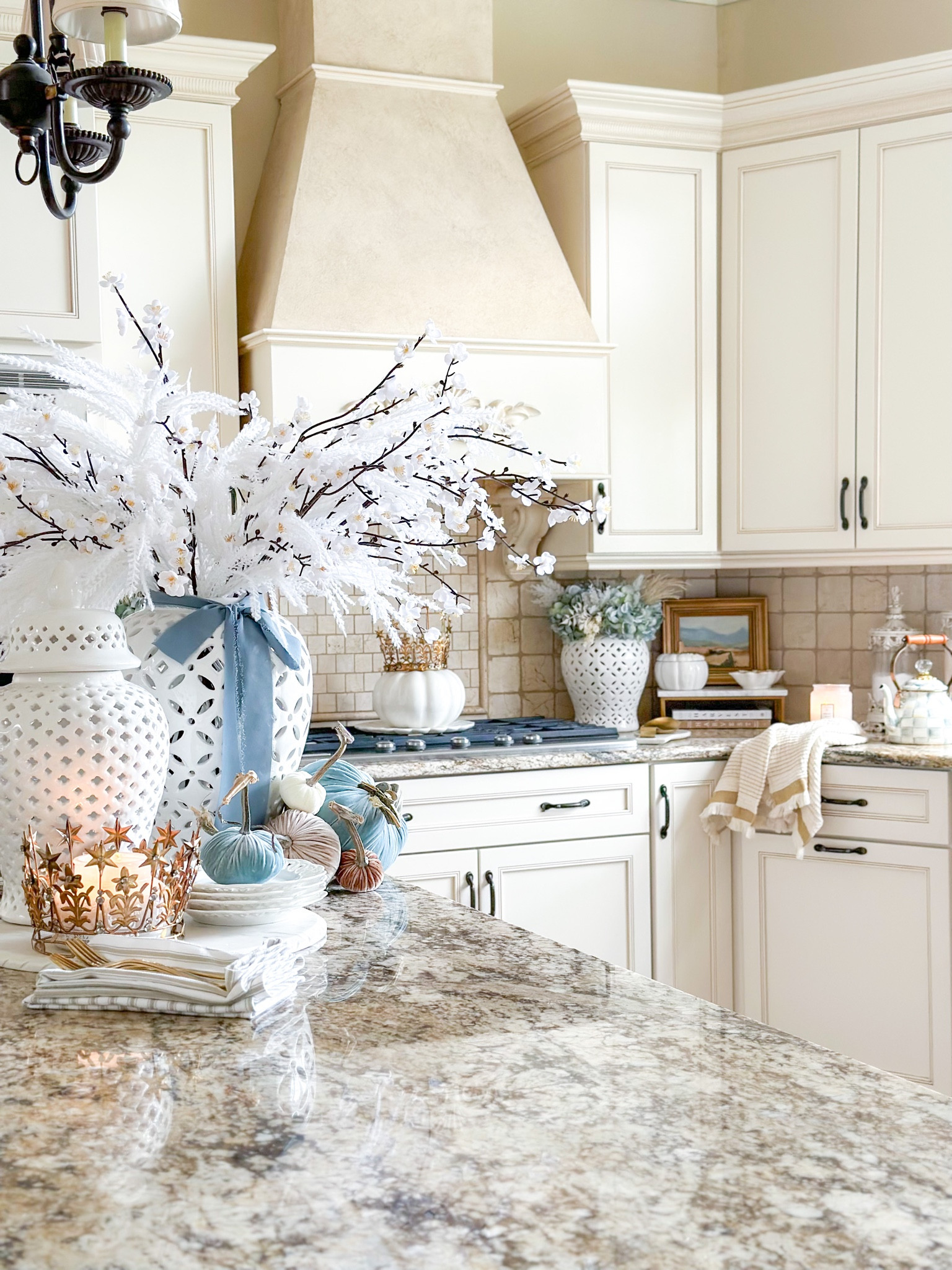 Blue and white fall kitchen decor! I’m obsessed with these white velvet plum blossoms, currently on sale!

Gold crown, white candles, Voluspa, capri blue, velvet pumpkins, hot skwash, white ginger jars, plum blossoms, pampas grass, marble tray, petal tray, pottery barn, blue hydrangeas, Mackenzie Childs tea pot, sterling check, white pumpkin, blue pumpkins, fall entertaining

#LTKHoliday #LTKSeasonal #LTKhome