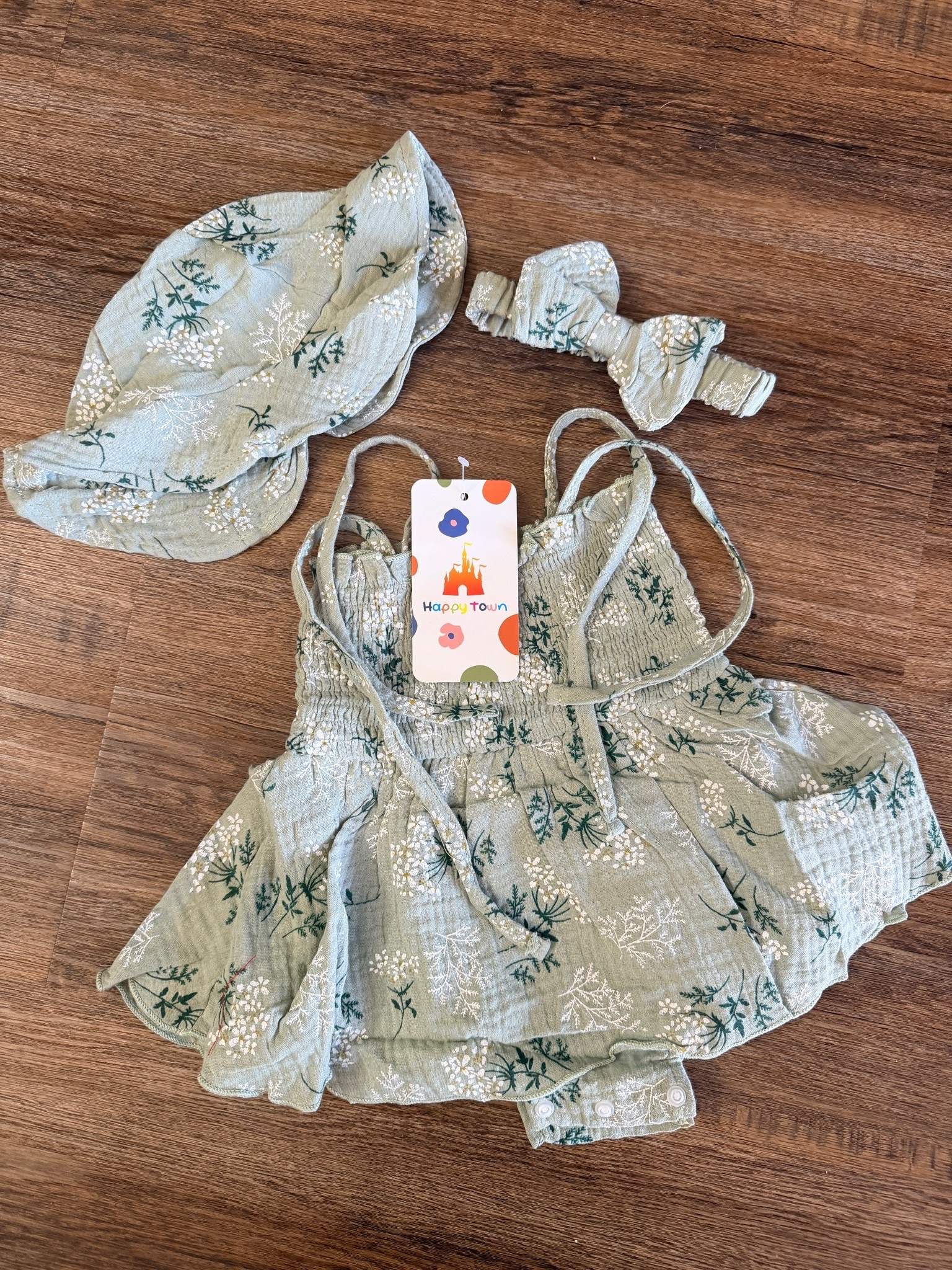 Obsessed is an understatement! How darling is this matching 3-piece baby girl summer outfit set? This gorgeous sage green floral baby romper is made from the softest, breathable cotton muslin fabric, making it the perfect lightweight baby clothes choice for hot summer days, beach vacations, or family photos.

This adorable infant girl clothing set comes complete with a matching baby sun hat (bonnet style) and a cute baby bow headband to keep your little one looking stylish from head to toe. The romper features a comfortable smocked bodice, adjustable tie straps, and convenient snap closures at the bottom for easy diaper changes.

Whether you’re looking for boho baby clothes, cottagecore baby outfits, or the perfect baby shower gift for a baby girl, this set is a must-have for your little one's summer wardrobe!

baby girl summer outfits, sage green baby clothes, floral baby romper, muslin baby clothes, baby girl matching set, baby sun hat and romper, boho infant clothes, cute toddler summer fashion, Happy Town baby clothes, affordable baby boutique finds. 

 #LTKSeasonal #LTKBaby #LTKKids