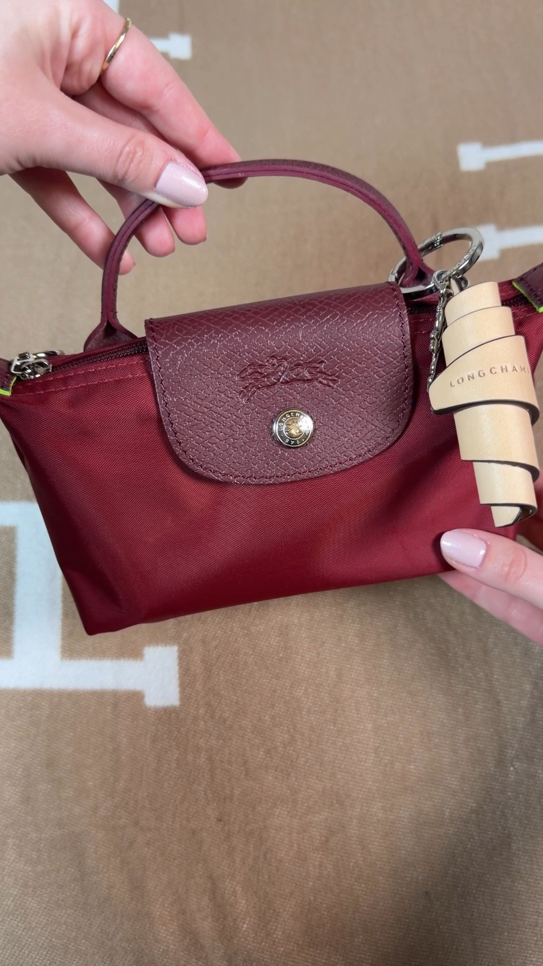 Just added the Longchamp Le Pliage green pouch in the color pomegranate to my collection 😍 this deep red color is beautiful no matter the time of year. Its vibrancy with the lime green line detail works great in spring and summer and the deep richness of the color is stunning with fall and winter outfits. A truly year round mini bag 😍
 
The Longchamp green Le Pliage line has silver hardware which is totally different from most of my bags since I tend to gravitate towards gold hardware. I trying to branch out more 😂

I got the Longchamp leather croissant key ring to add as well 

#LTKFestival #LTKdayinmylife #LTKootd