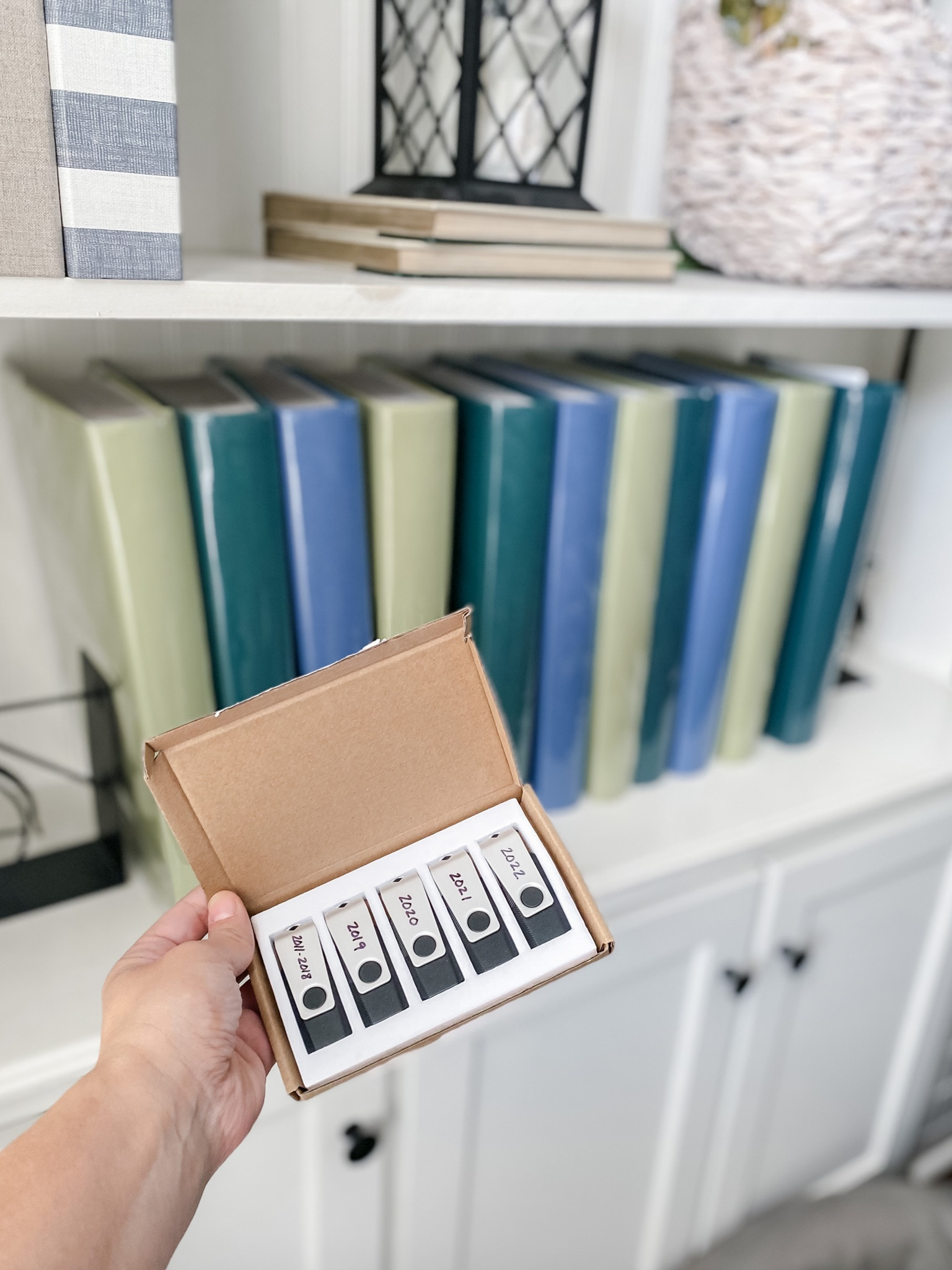 My photo organization system includes both albums for printed pictures and USBs for digital pictures!

#LTKfamily #LTKhome #LTKunder50