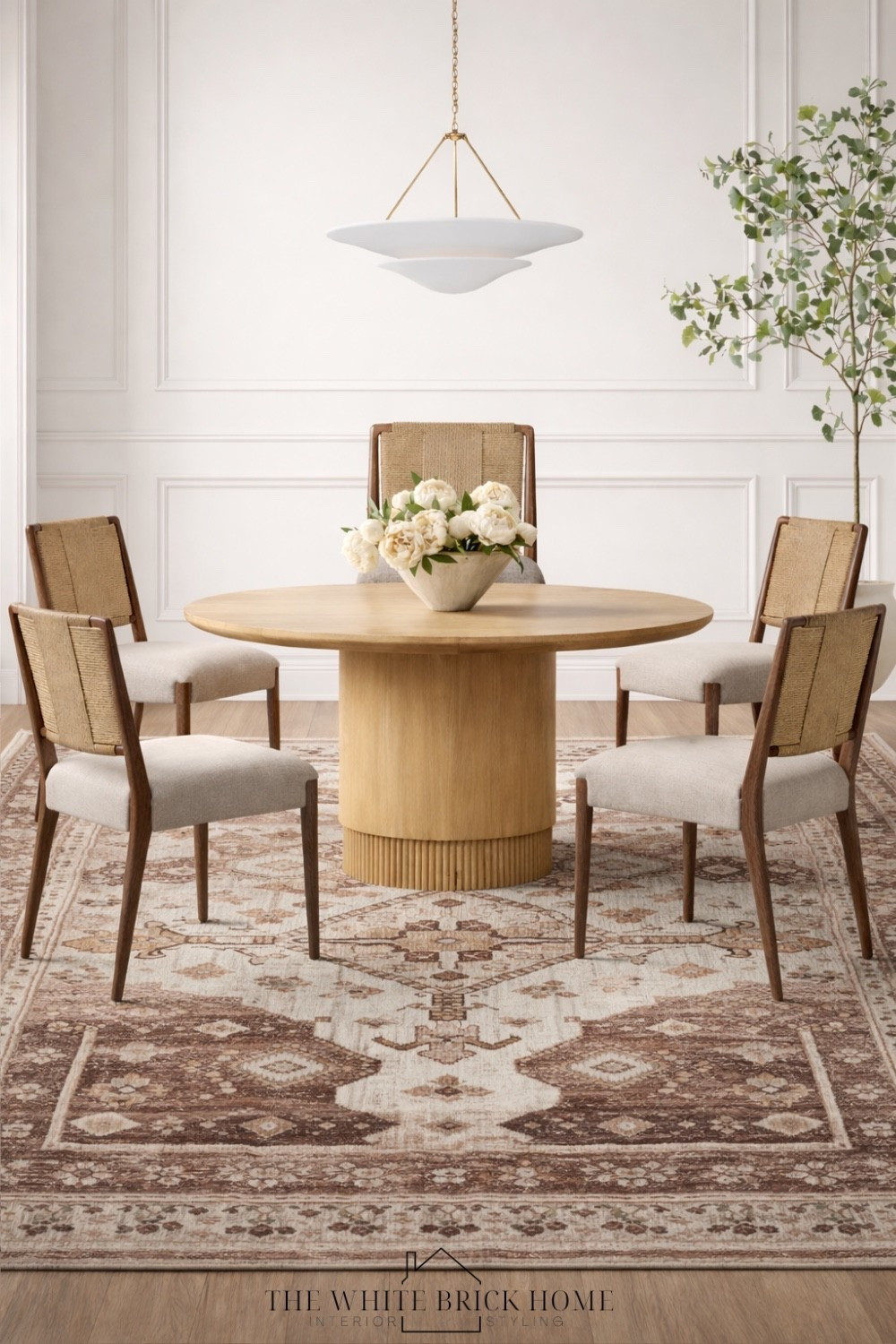 A warm, modern traditional table and chair pairing with texture and a vintage inspired rug for an elevated look.

Dining room, dining table, round dining table, dining area, dining room design, eat in kitchen table, dining chair, dining room furniture, dining furniture, chandelier, light pedant, area rug, dining room rug, dining design, McGee and co, crate and barrel 

#LTKHome #LTKSaleAlert #LTKSeasonal