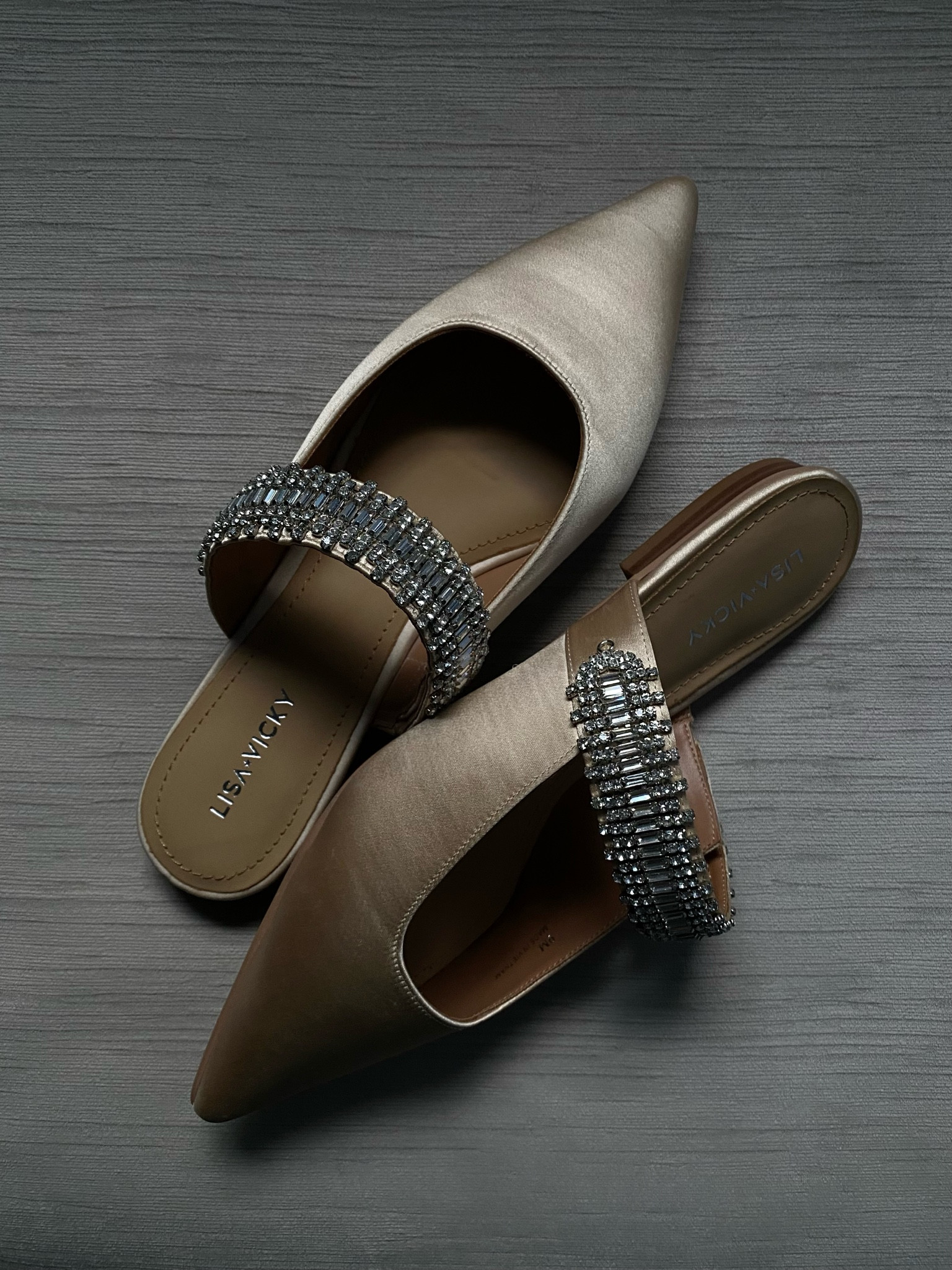 The prettiest crystal-embellished pointed to satin flats that are super similar to the Manolo Blahnik Lutaraflat Mules that have sold out. 

This is the champagne color way, but note that it’s lighter than the photo shows online.

Also comes in a pretty jewel-toned purple so it’s perfect for special events such as weddings!

#LTKFindsUnder50 #LTKShoeCrush #LTKWedding