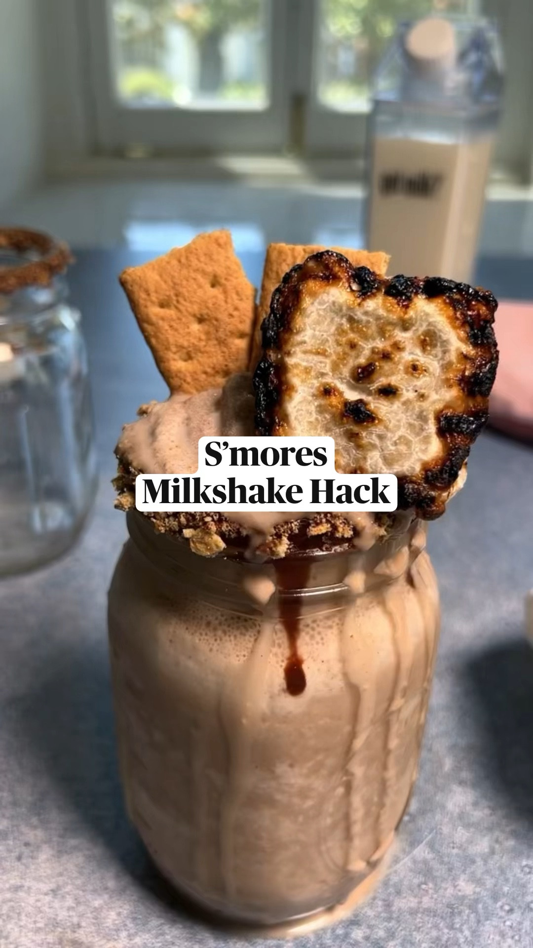RECIPE BELOW. PS- Did you know that real milk hydrates better than water? By simply freezing milk into cubes, you can create this hydrating sweet treat, perfect for summer. Plus, milk is full of nutrients that support a healthy immune system, making this s’mores smoothie both nutritious and indulgent at the same time (which is super important for this pregnant girlie)!

For more on the benefits of real milk, visit gotmilk.com/nutrition for more information @gotmilk #GetRealMilk #GotMilk

S’mores Milkshake

INGREDIENTS

2% Milk
3 tbsp Chocolate Syrup
7 Graham Crackers
¼ cup Chocolate Chips
2 tsp Coconut oil
1 Marshmallow

INSTRUCTIONS

Fill ice cube containers with milk and freeze until solid.
Roast marshmallow as desired
Microwave chocolate chips and coconut oil in 10-second increments until melted.
Crush two graham crackers into fine pieces in a plastic bag.
Dip the rim a mason jar into melted chocolate and coconut oil mixture, and then dip into crushed graham crackers.
Add 3 frozen cubes to a blender. Drizzle chocolate syrup and add 4 graham crackers. Pour in ⅓ cup of milk and blend until smooth.
Pour milk “smoothie” into jar, top with 2 graham cracker halves and toasted marshmallow. Enjoy

#LTKFind #LTKSeasonal #LTKhome