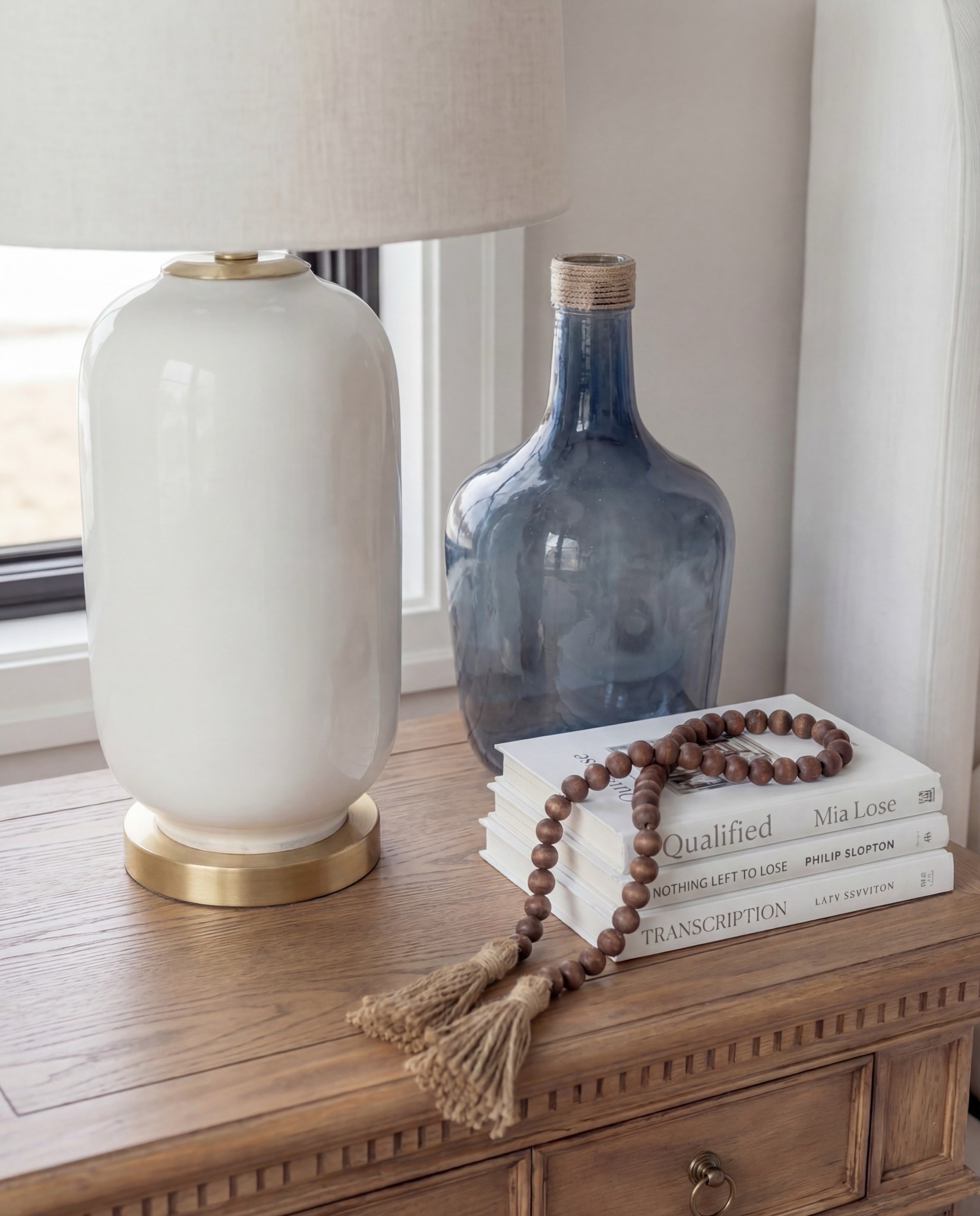 Shop the Look: Bedroom Refresh
• Upholstered bed frame (soft ivory fabric)
• White bedding set (cotton or linen)
• Chunky knit throw blanket (dusty blue)
• Blue and ivory accent pillows
• Wood nightstands (warm oak tone)
• Ceramic table lamps (white with brass detail)
• Blue glass decorative bottles
• Framed blue botanical wall art (set of three)
• Upholstered bench with fluted wood base
• Vintage-style area rug (beige, taupe, muted blue)
•White decor books
•Wood Decor beads 


#LTKHome #LTKSpringSale #LTKSaleAlert