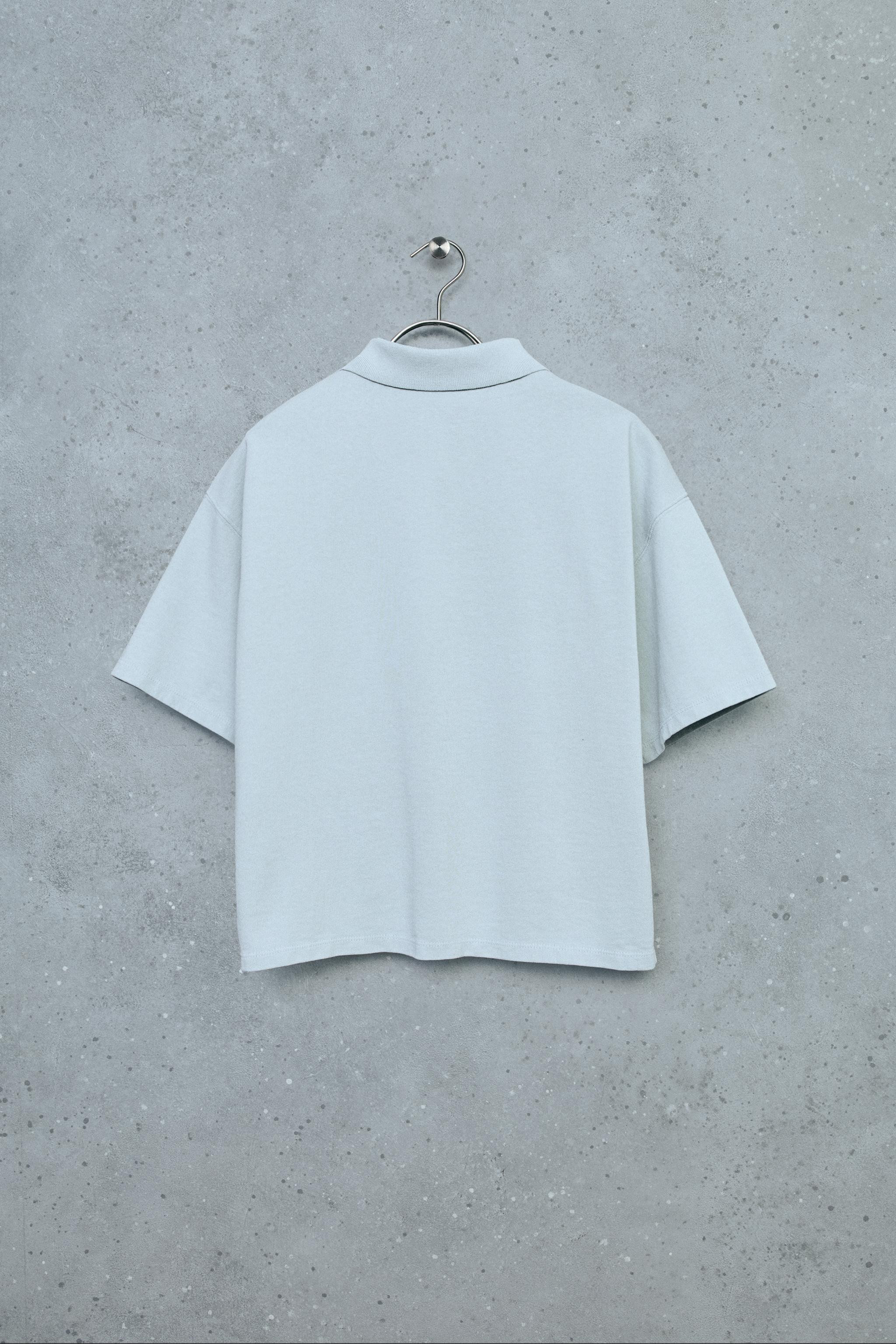 Polo shirt with polo collar and short sleeves. Button closure at yoke. Made of cotton fabric. | Zara US