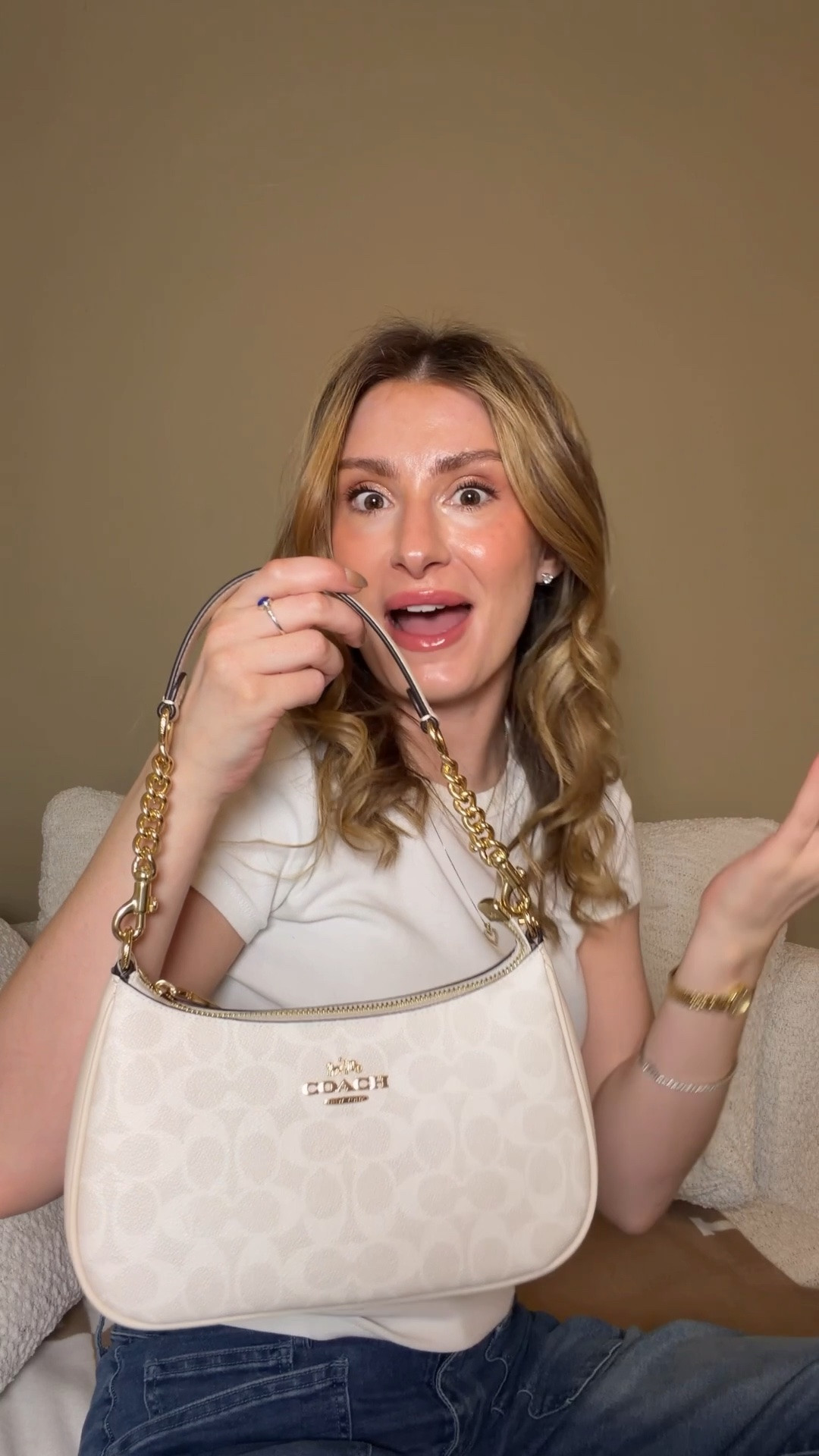 The classiest lil Coach Outlet bag ever! 🤍 Comment SHOP & I’ll dm you the link 🤍

I got this white Teri at the latest Coach outlet drop and I am obsessed! The white signature canvas print on off white with gold hardware gives it such an elevated classy look. This is going to be my going out bag for summer ☀️ I could also see brides carrying this to their rehearsal dinner, with their bachelorette outfit, or on their honeymoon.

The strap has leather in the shoulder part which is a must for comfort! But you still get the beautiful chain detail in the sides of the strap.

She also come with a crossbody strap! This is the regular sizes Coach outlet Teri