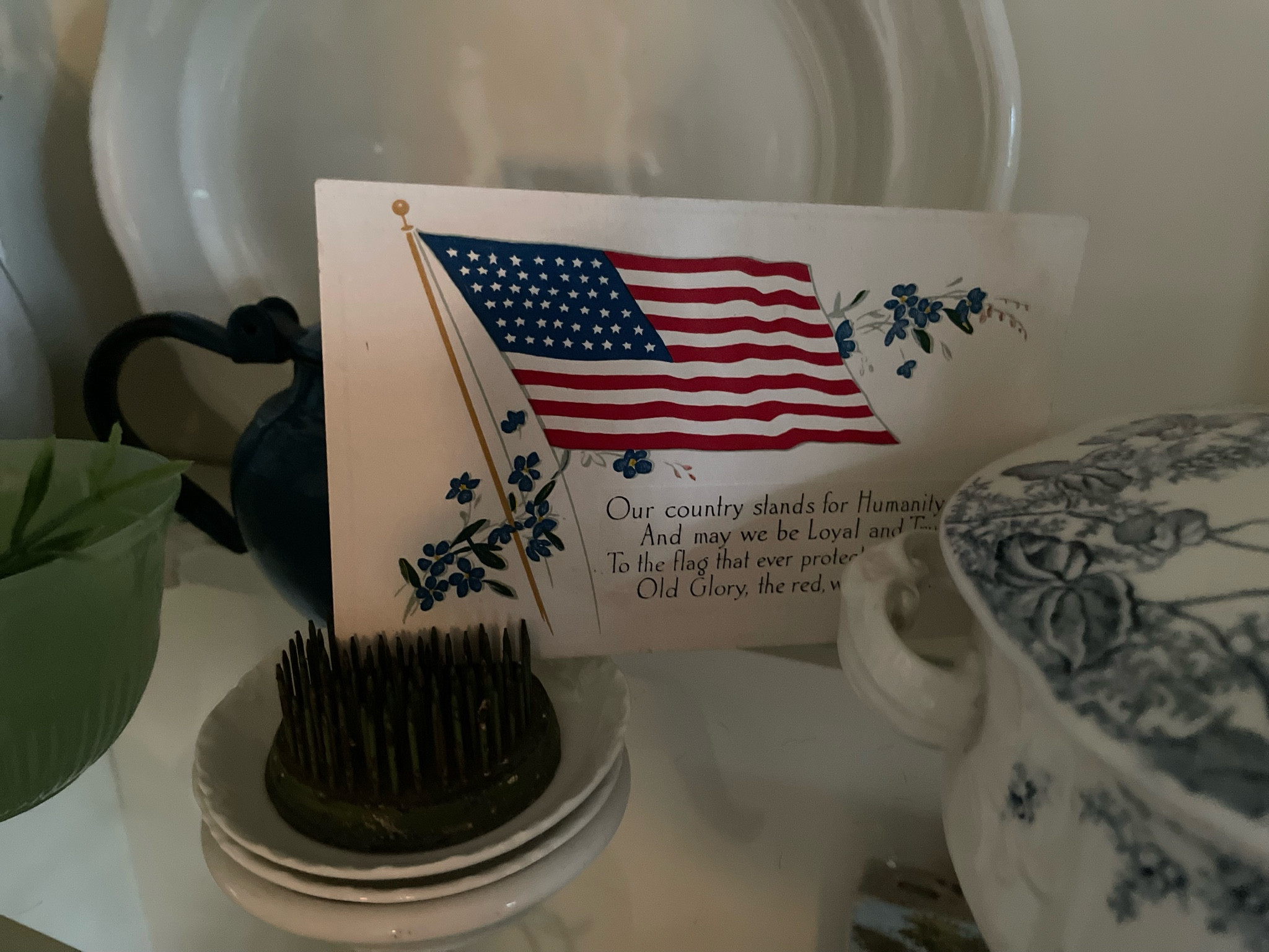 Decorating for patriotic holidays needn’t be difficult! Keep it simple, and budget friendly, by tucking in a few red, white, and blue items here and there. 
Flower frogs are an easy way to display vintage postcards or ephemera for occasion. You can also use vintage dishes with red, white, or blue patterns as well as ironstone and milk glass. 

#LTKFindsUnder50 #LTKHome #LTKSeasonal