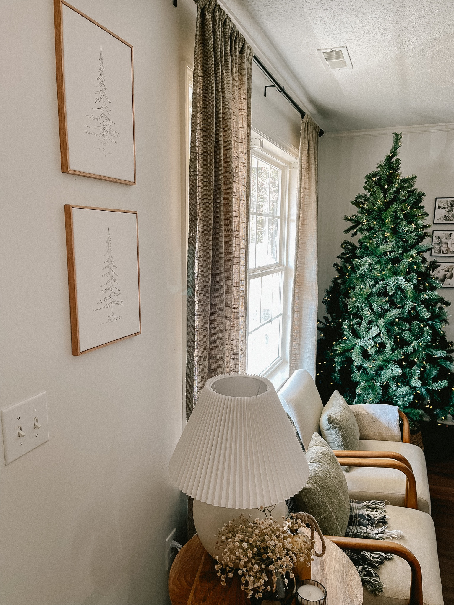 Christmas Art. Christmas tree. Living room holiday decor. Home decor. Gold bells. Curtains. Mcgee Holiday. Christmas tree art. Neutral holiday decor. Accent chairs. Accent pillows. Throw blankets 

#LTKsalealert #LTKHoliday #LTKstyletip