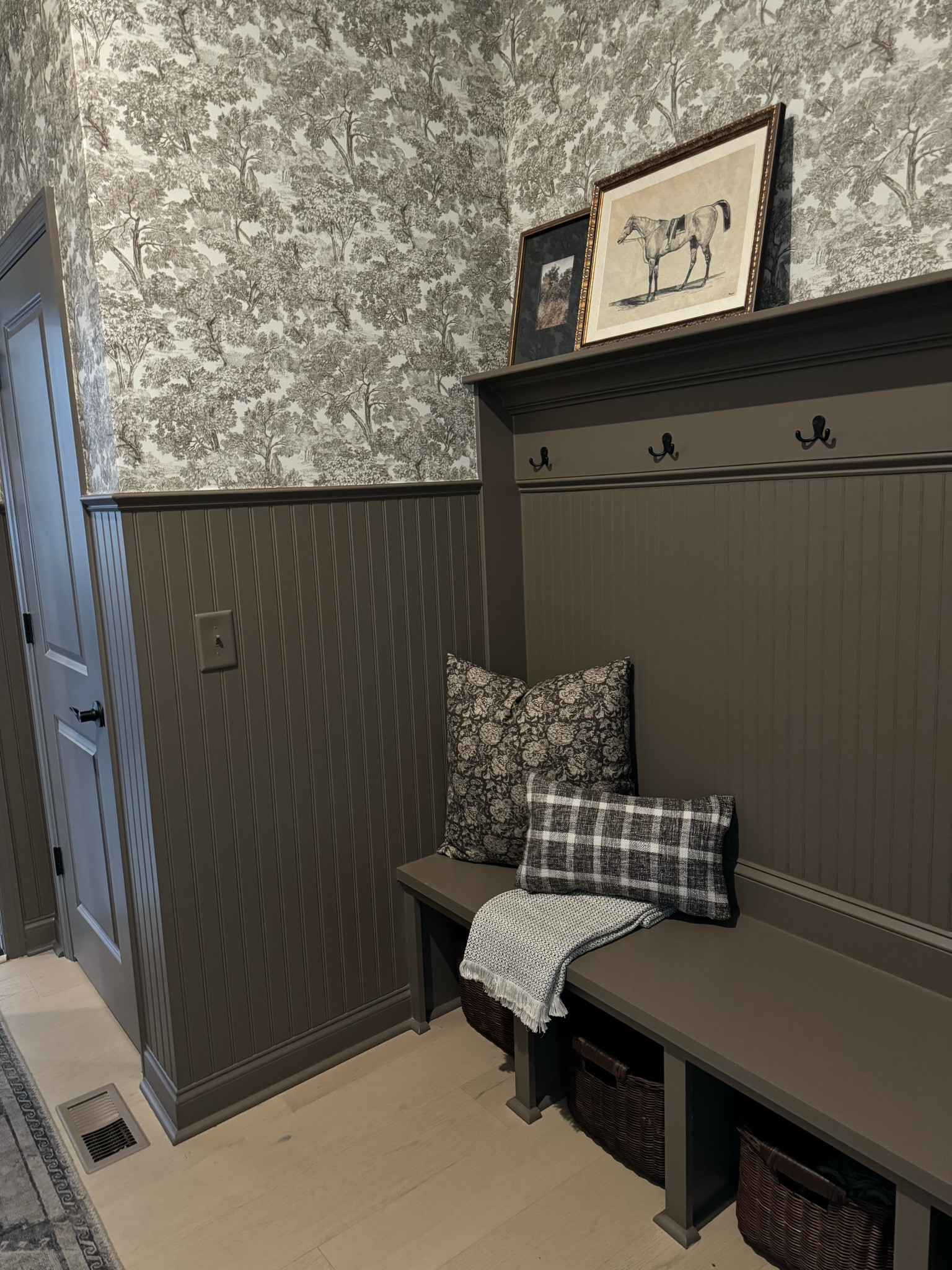 Our mudroom progress! The wall color is Fairview Taupe by BM. The dark framed art is from Target but out of stock sadly  