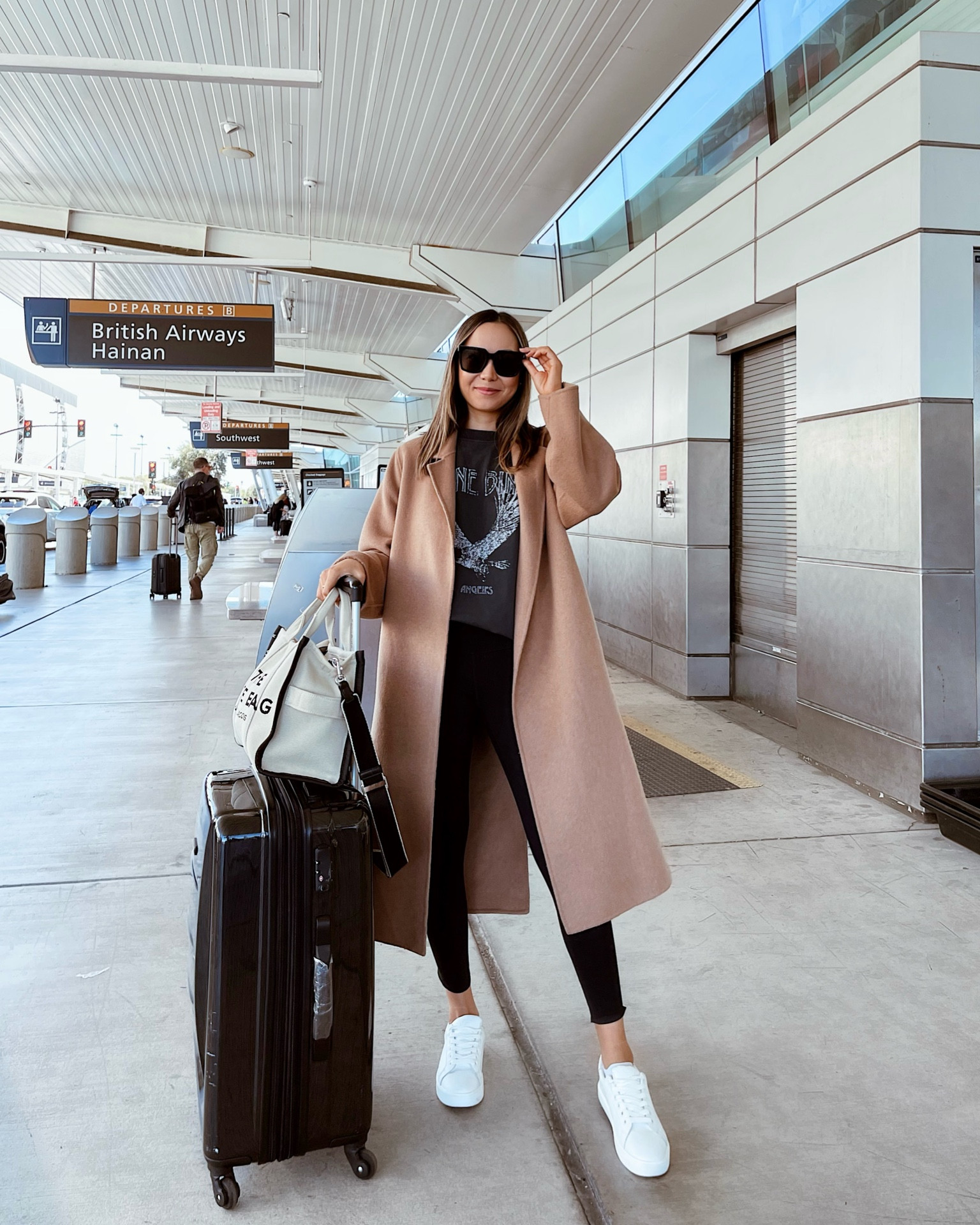 Travel outfit 
Camel coat xs 
Anine bing tee small 
Sneakers / suitcase / casual fall style 

#LTKunder100 #LTKtravel #LTKstyletip