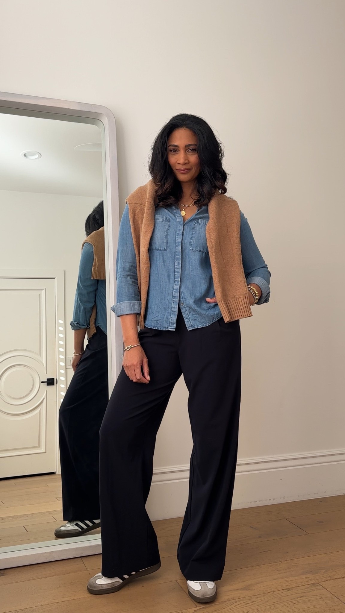 Pair a button down denim shirt with black trousers and a chunky knit layer for an easy casual early spring outfit. Trousers fit true to size.



#LTKTall #LTKOver40