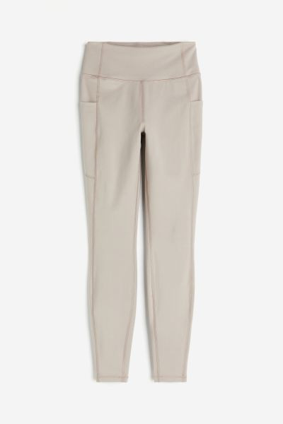 DryMove™ Pocket-detail sports tights - Light beige - Ladies | H&M GB | H&M (UK, MY, IN, SG, PH, TW, HK)