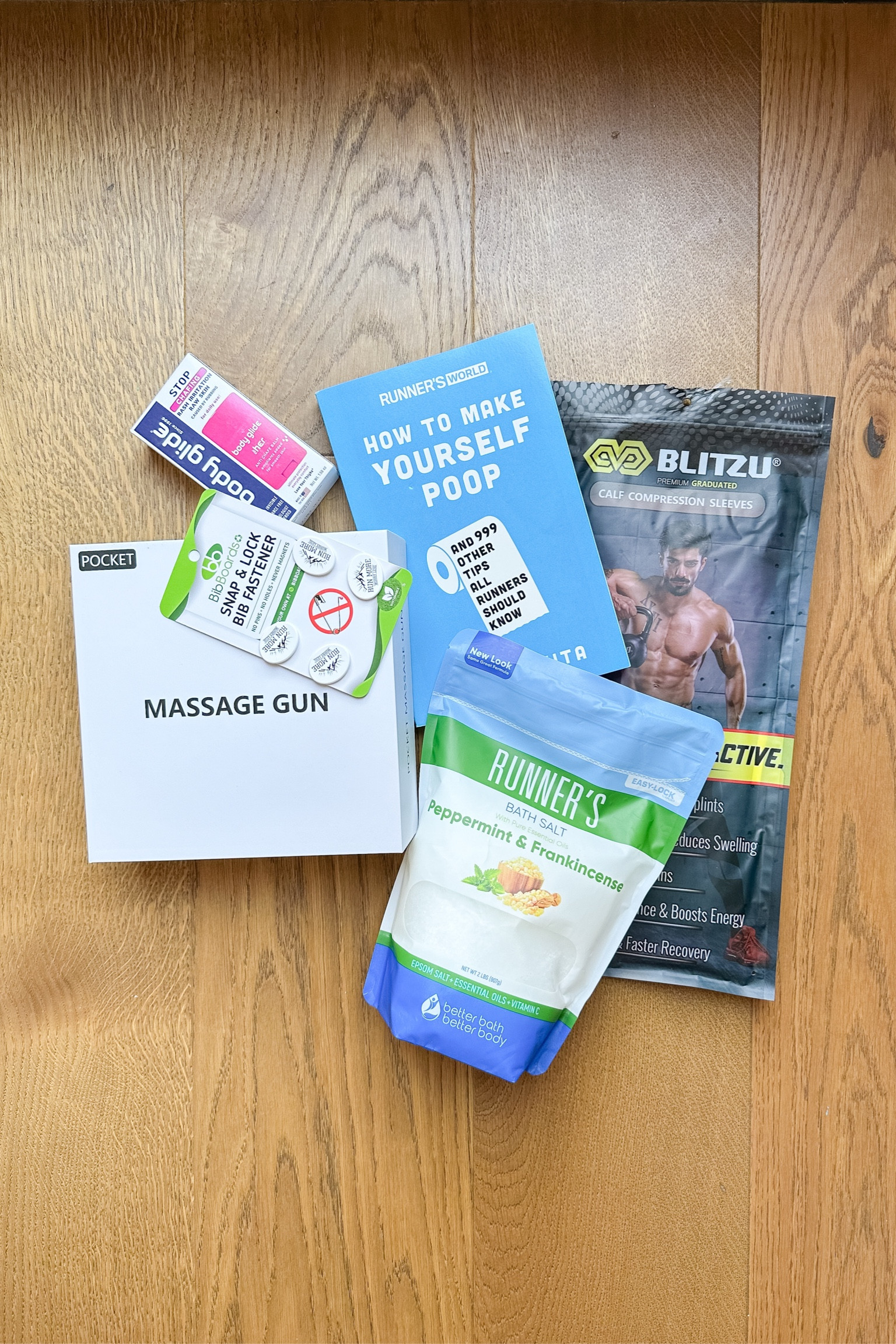 Care package for the runner in your life! Marathon recovery supplies. Massage gun. Compression sleeves. Running book. 

#LTKFitness #LTKActive #LTKSaleAlert