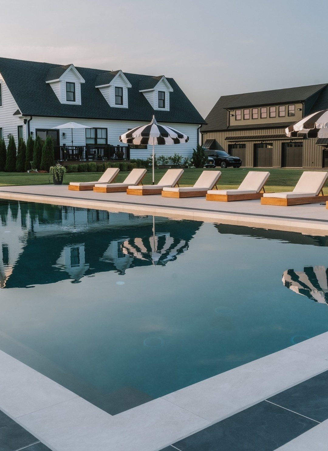 #AD Resort style vibes but it’s really just your backyard. These modern teak loungers from @Wayfair are giving luxe resort vibes but at home. 

#wishyouwerehere #outdoor #Wayfair #Wayfairpartner 

#LTKSeasonal #LTKHome #LTKSaleAlert