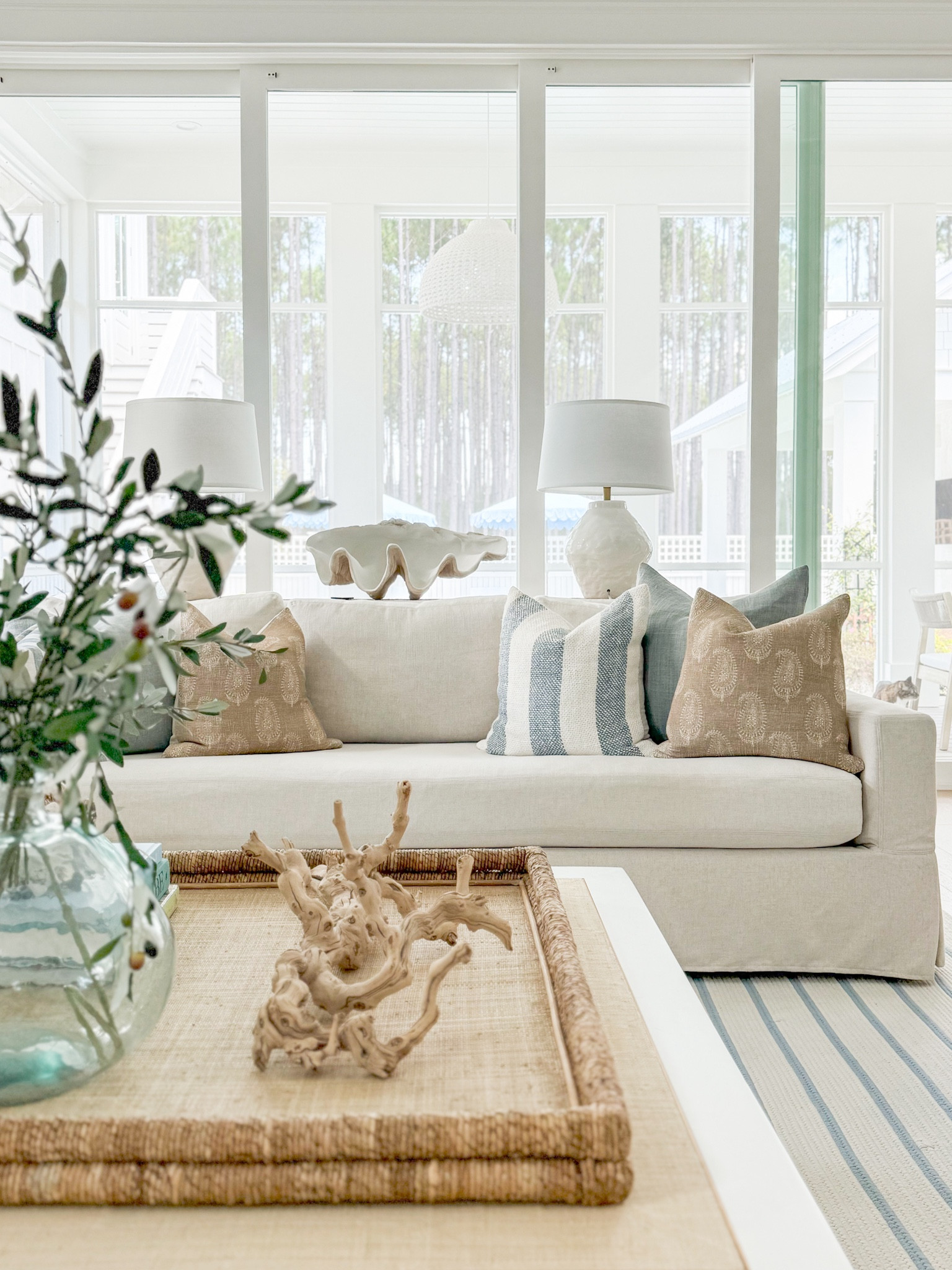 Our living room decorated for fall! Includes our linen sofas, striped rug, paisley throw pillows, faux olive stems, raffia coffee table, white ceramic lamps, acrylic side tables and more!
.
#ltkhome #ltkseasonal #ltkvideo #ltksalealert #ltkstyletip #ltkfindsunder50 #ltkfindsunder100 coastal fall decor

#LTKHome #LTKSeasonal #LTKFindsUnder50