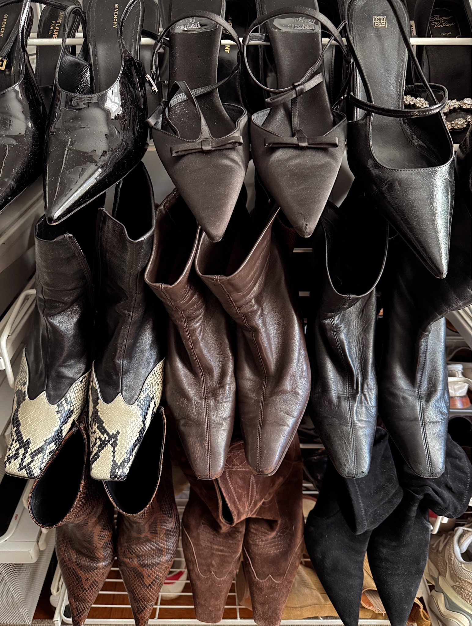 Current lineup of the boots (and a few shoes) I'm wearing the most. 

The #EmmeParsons i have in two colors and love them so much. They run true to size. In the #KhaiteBoots, I size up from my usual 39 to a 39.5. Such a splurge but the quality on them is a 10/10. Comfort too! 

The storage system is the container store Elfa System. 