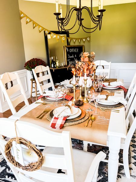 Friends are the family we choose! Get everything you need for a fabulous Friendsgiving brunch! Table decor including faux fall stems as the centerpiece with mini grapevine pumpkins and beautiful gold candlesticks. Each place setting is layered with woven placemats for wood charger white dinnerware and linen napkins. Burnt orange color scheme for a neutral autumn party. #Friendsgiving #Thanksgiving #tablescape #diningroomdecor #entertainingathome

#LTKhome #LTKSeasonal #LTKHoliday