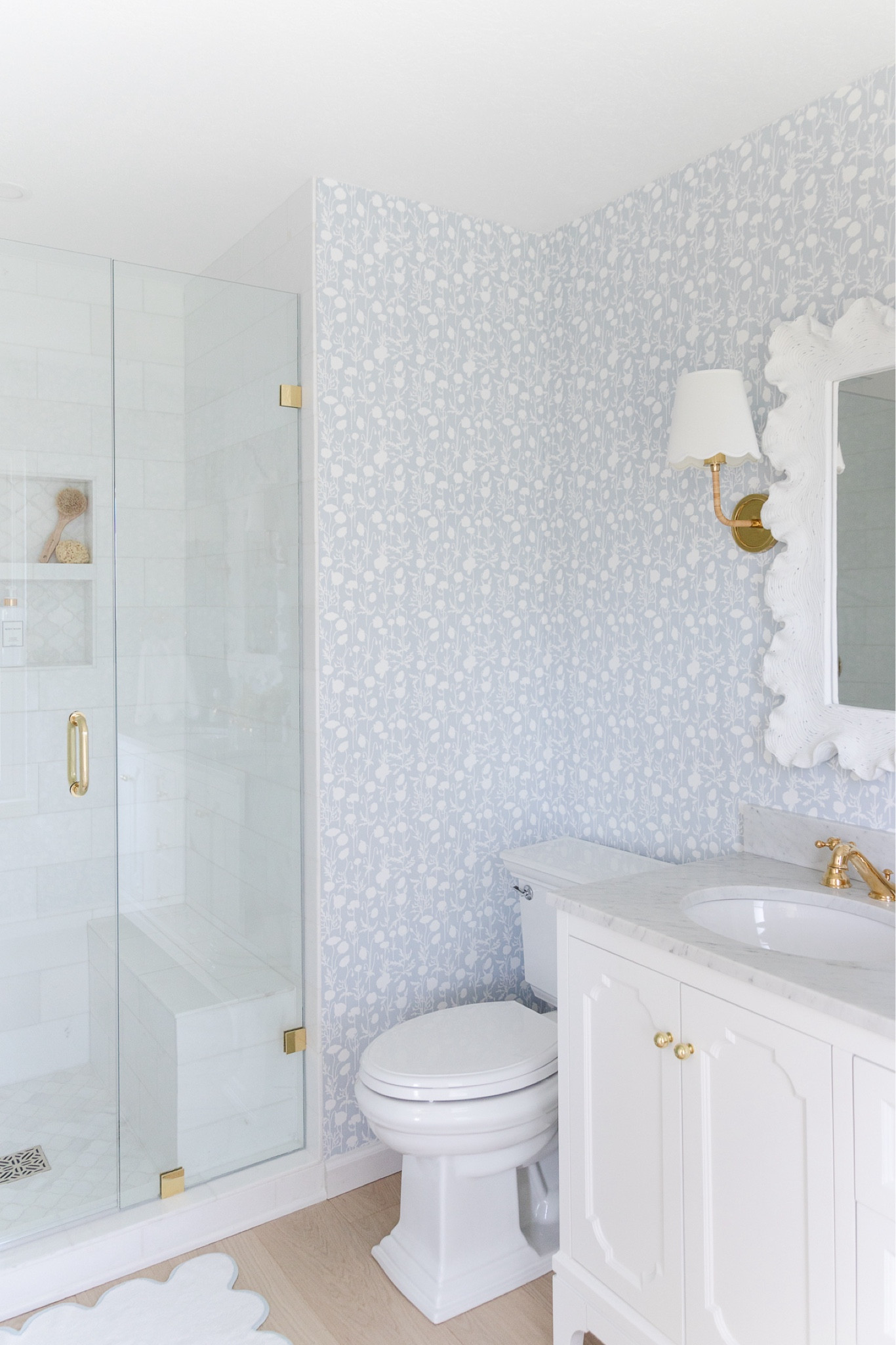 I designed our lake cottage primary bath with pretty blue hues, patterned wallpaper scallop decor and lighting to make it feel cheerful and fun! Marble vanity and brass lighting and hardware add warmth and function! 

#LTKHome #LTKStyleTip #LTKSaleAlert
