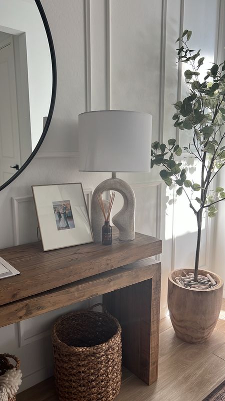 Love this area of our entryway! Tree is a faux tree from Amazon, lamp is an Amazon find with the magic bulb inside. Console table and picture frame linked too. 

Home decor
Home finds
Target home
Amazon home
Neutral home decor 

#LTKunder100 #LTKhome #LTKunder50