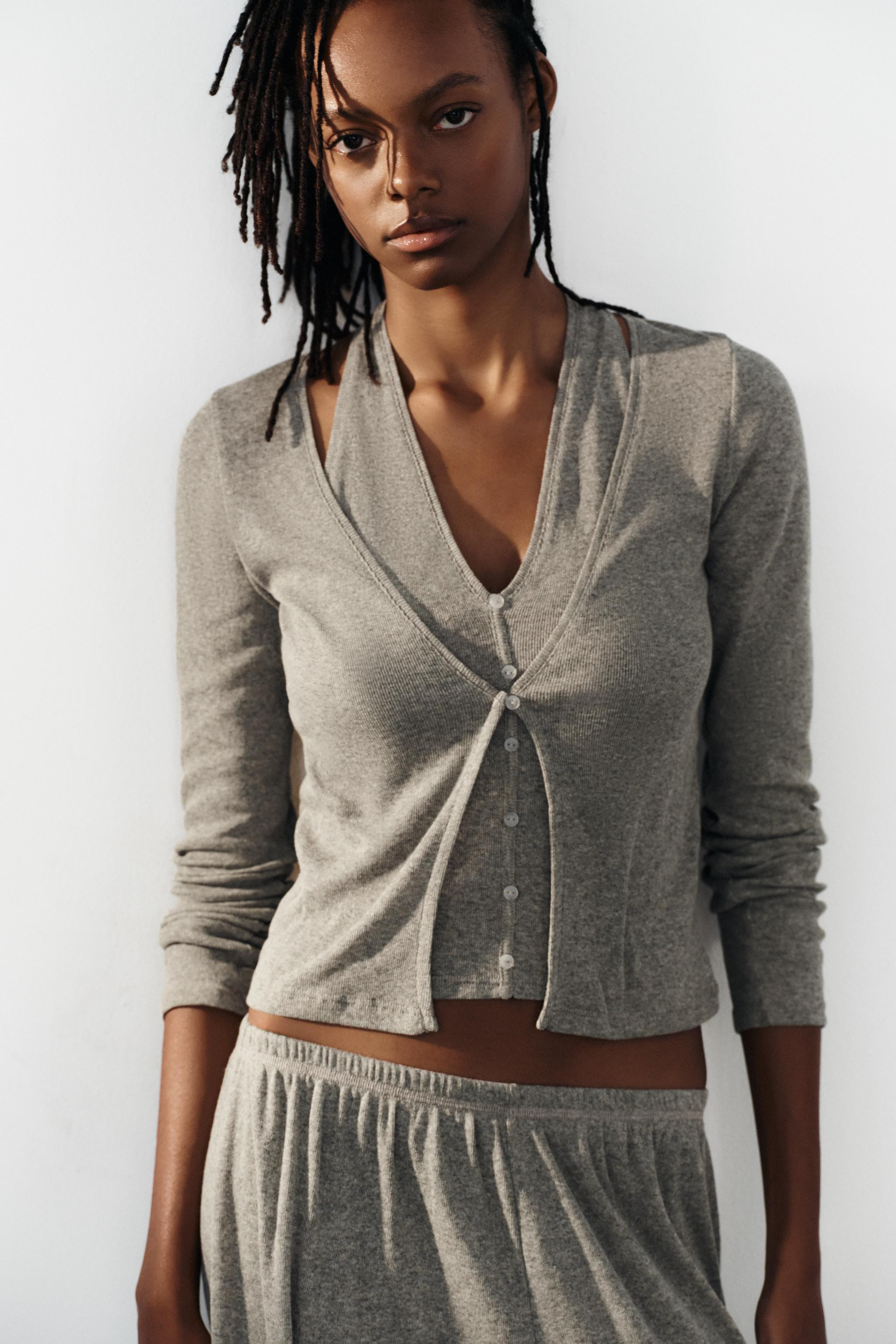 V-neck top with long sleeves. Featuring an interior halter top with a layered effect. Front butto... | Zara UK