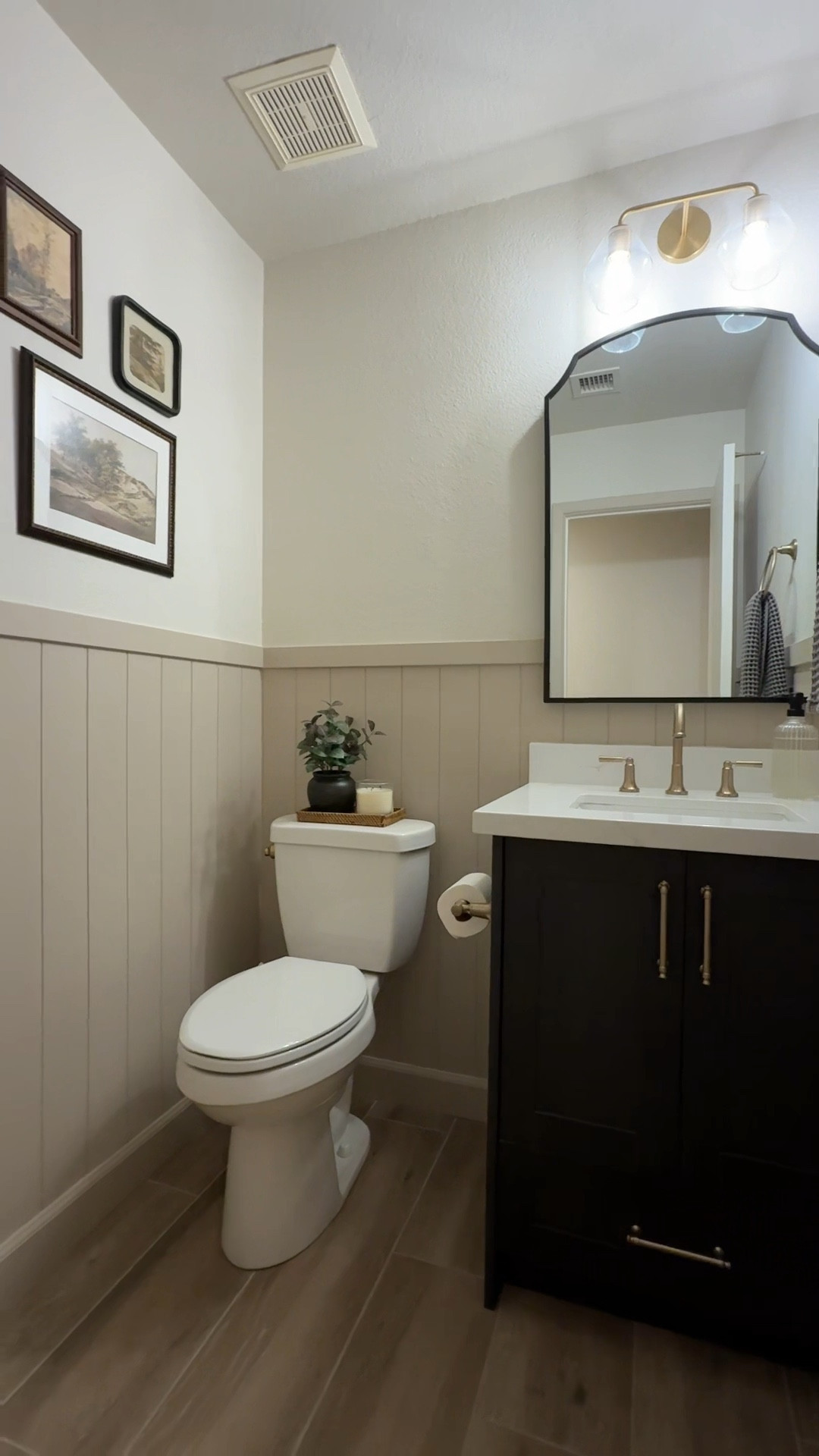 Powder room reveal! So happy with how this turned out!! Love the shiplap against the black cabinet. Fixtures are all champagne bronze by Delta. 
#bathroom #renovation #champagnebronze #bathroomvanity #homedecor #bathroomdecor #decorinspo 

#LTKVideo #LTKHome #LTKStyleTip