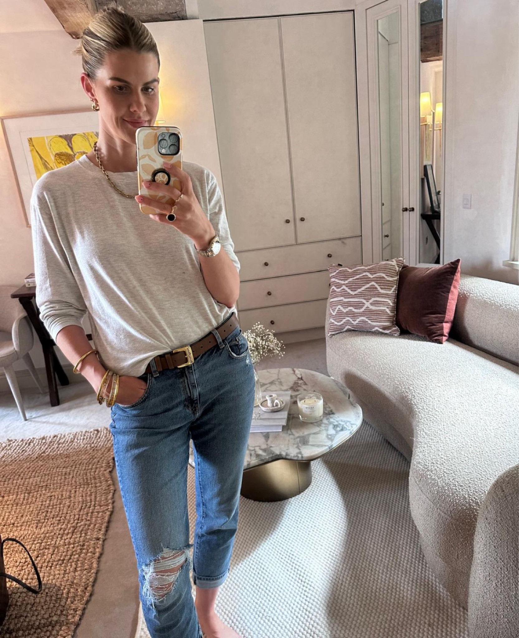 Denim ripped jeans and a grey loose top with a miu miu brown belt

#LTKireland #LTKstyletip