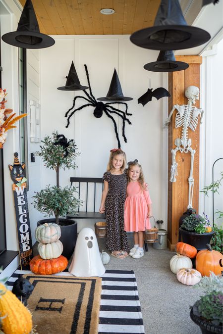 Halloween porch decor! We love these hanging witch hats, skeletons and the touches of orange! 

#LTKSeasonal #LTKhome #LTKstyletip