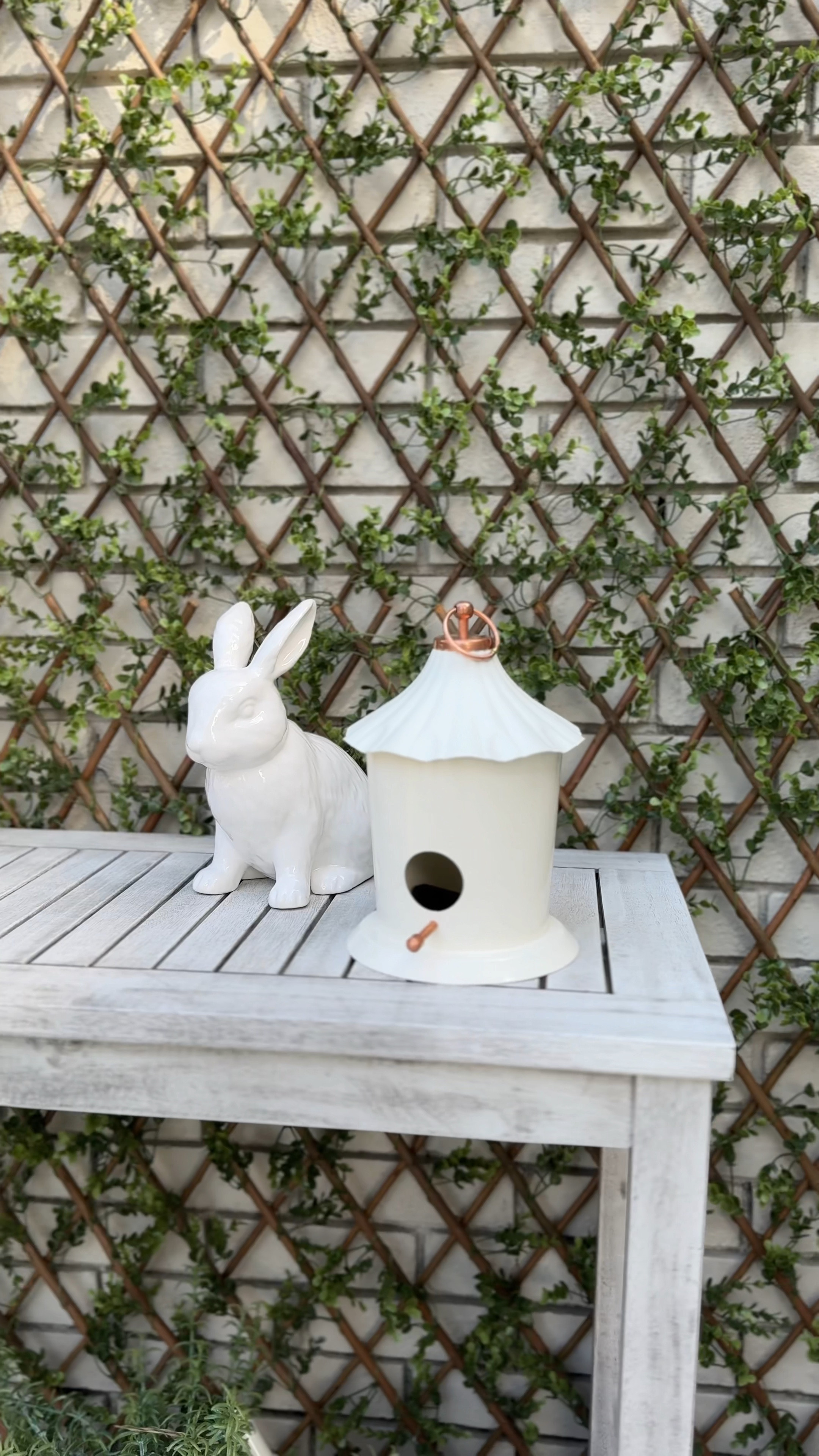 DIY trellis wall. I used 4 of the buxus single side artificial trellis grids here. All other items linked as well for this affordable patio addition! 

#LTKhome #LTKSeasonal #LTKVideo