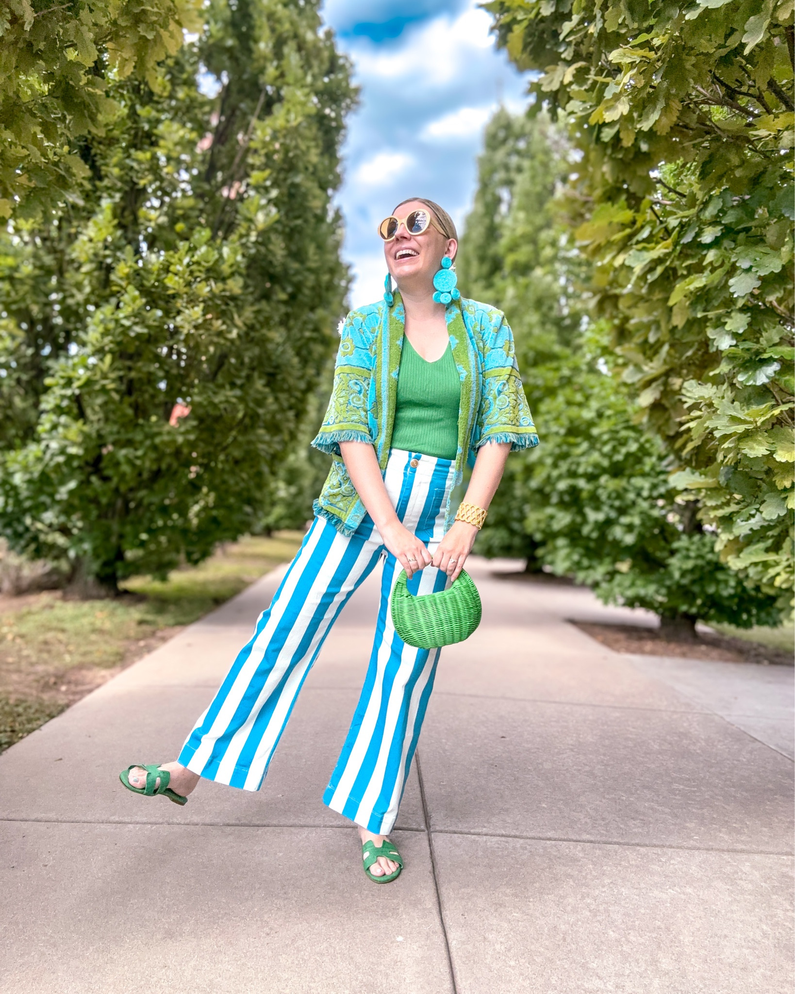 Look 9 - Main Street Muse 🎡 
A curated style series

As soon as I put together this look I thought, “why don’t we all dress like THIS every day?!” 🌈✨ This upcycled top was made from a vintage towel, and it’s everything I love in an outfit: super comfortable, totally unique, colorful, and fun. It’s proof that fashion can be playful and practical. I’ve linked similar pieces in other colors so you can get the vibe too! 💕

🌟 About Main Street Muse: Each of my capsule collections is a two-week style story. This one is about holding onto every last golden moment of summer while embracing the shift into fall - full of retro details, bold colors, and a touch of small-town Americana charm. It’s whimsical, romantic, and joyfully wearable.

Top - Canned Ham Vintage (linked to similar upcycles they currently have available!)
Earrings - Simon Miller (linked)
Jeans - Maeve Anthropologie (Amazon similar look version linked)
Shoes - Belk, Crown & Ivy (linked)
Bag - Kate Spade x Target (linked)
Sunglasses - Gucci (linked)
Rings - Rocksbox (similar linked)
Bracelet - Lilly Pulitzer (linked)

#MainStreetMuse #UpcycledFashion #VintageStyle #RetroVibes #WhimsicalWardrobe #CapsuleWardrobe #StatementStyle #ColorfulStyle #CapsuleCloset #OOTDinspo #SustainableStyle #EclecticFashion #TransitionalStyle #ReworkedVintage

#LTKSeasonal #LTKShoeCrush #LTKTall