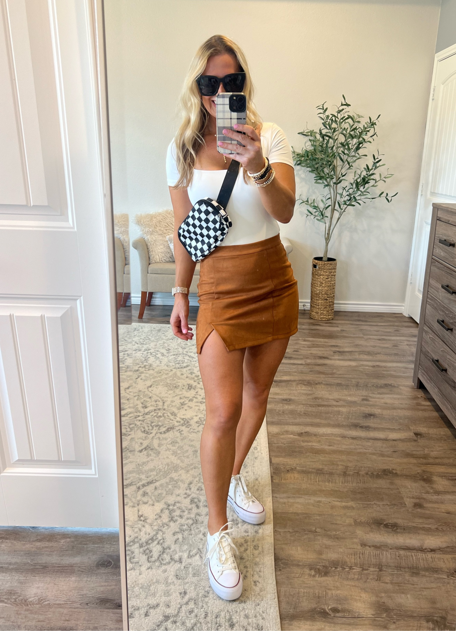 Raise your hand if you’re ready for pumpkin EVERYTHING? 👋🏼 I’m loving styling mini skirts these past few days. You can truly dress them up or down. Trendy fall outfits here we come! 🍁🍁🍁

Camel skirt amazon. Fall skirt amazon. Fall mini skirt outfit. Casual fall outfit. Ways to wear fall mini skirt amazon. Trendy Fanny pack. Black & white checkered Fanny pack bag. Casual bag amazon. Trendy bad amazon. Converse dupes amazon. Platform converse amazon. White converse outfit. Mini skirt outfit. Fall skirt outfit amazon. Brown skirt trendy amazon. Casual chic fall outfit amazon.

#LTKSeasonal #LTKsalealert #LTKstyletip