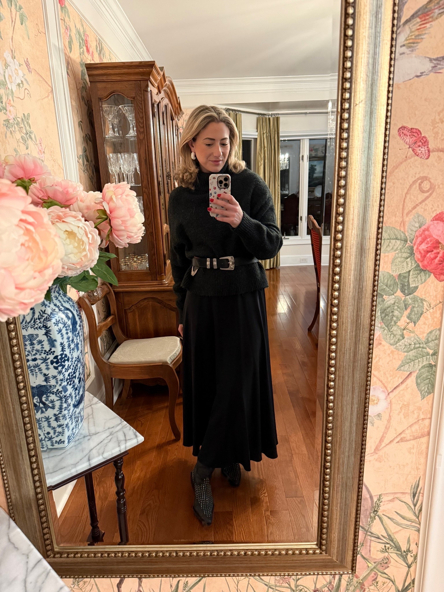 This outfit is all about elegant proportions. A cozy knit sweater cinched with a statement belt, paired with a flowing black midi skirt and textured cowboy boots. It’s classic but not boring, polished yet comfortable, and the kind of look that works just as well for everyday wear as it does for dinner plans.

✨ Everything is linked here timeless pieces you’ll style again and again.

#LTKgrwm #LTKWorkwear #LTKootd