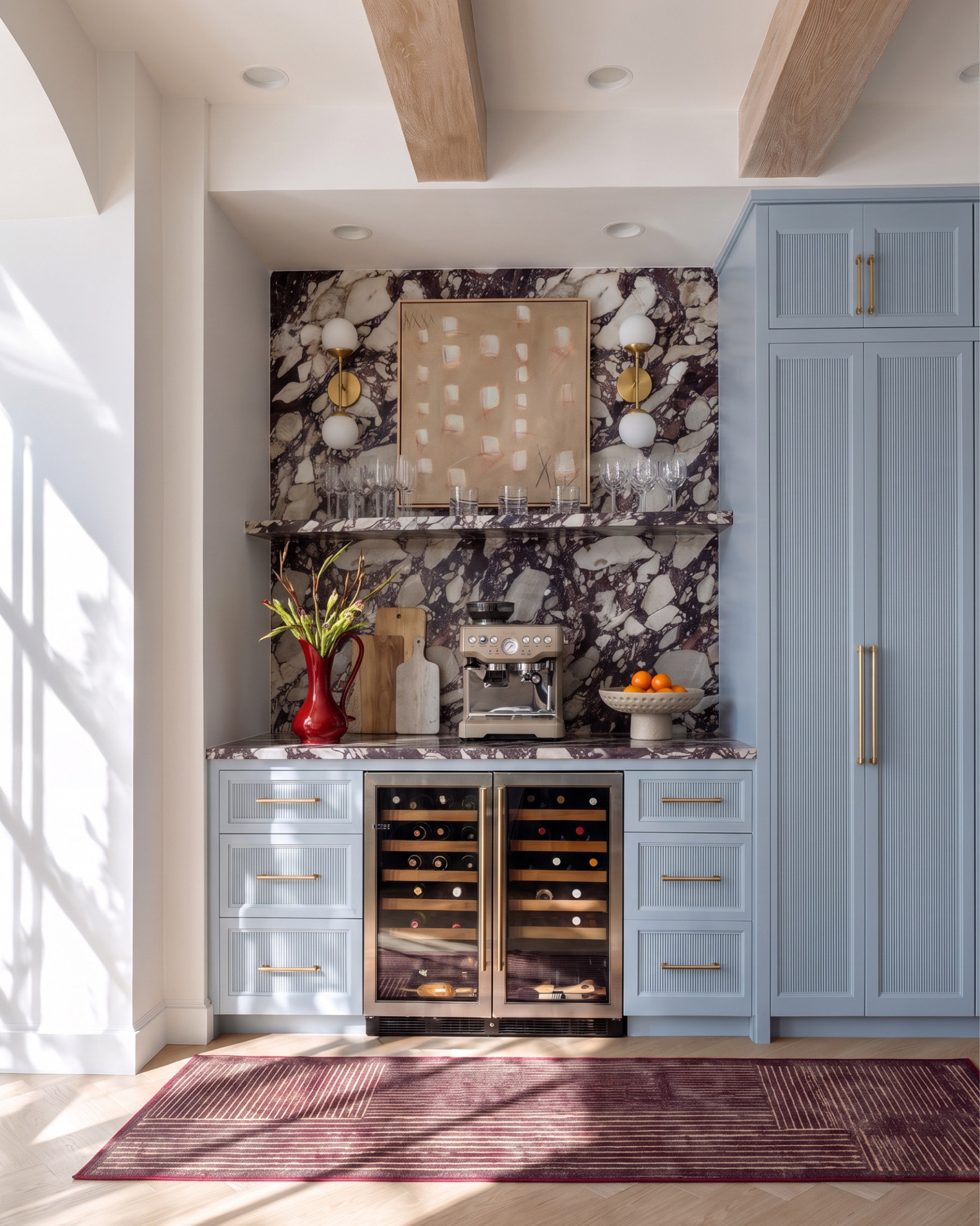 Shop the Look:
* Purple and cream stone slab backsplash
* Fluted powder blue cabinetry
* Brass bar pull hardware
* Dual zone wine and beverage fridge
* Built-in glass front cabinet
* White globe wall sconce (double)
* Abstract framed art print
* Red glass pitcher vase
* Wood cutting board set
* Breville espresso machine
* Hammered ceramic pedestal fruit bowl
* Striped runner rug
* Live edge wood console table
* Brass double globe wall sconce
* Abstract blue and red framed art
* Cranberry glass vase
* Marble table lamp
* Ceramic bust figurine
* Chunky knit jute pouf
* Blue and cream striped runner rug
* Framed abstract textile art
* Wood beam ceiling
* Marble top dining table
* Curved linen dining chairs (barrel back)
* Blue and white chinoiserie vase
* Wood frame china cabinet
* Textured red framed wall art
* Blue abstract vase
* Cluster globe pendant light
* Whitewashed wood sideboard
* Blue abstract shape framed art
* Ceramic textured floor vase
* Carved ceramic table lamp
* Brass shallow catchall bowl
* Vintage medallion area rug
* Antique wood buffet cabinet
* Gold hardware cabinet pull

#LTKsale #LTKhome #LTKstyletip