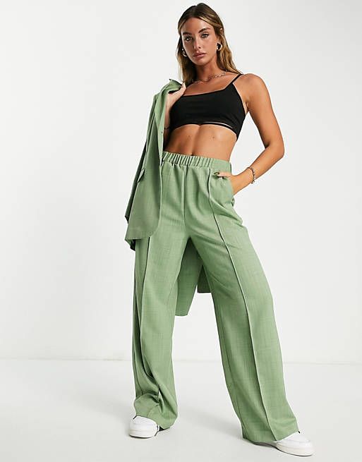 ASOS DESIGN suit pants with elastic waist in green | ASOS (Global)
