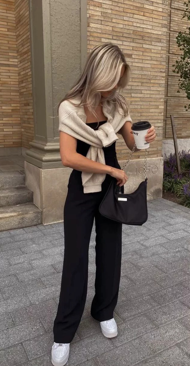 Chic everyday outfit featuring black wide-leg pants, a fitted top, and a sweater over the shoulders—perfect for elevated casual style and effortless outfit ideas.
Style tip: mix structured and relaxed pieces for a balanced silhouette, keep your color palette neutral for versatility, and use simple layering tricks like a draped sweater to elevate even the most basic outfit. 

 #LTKootd