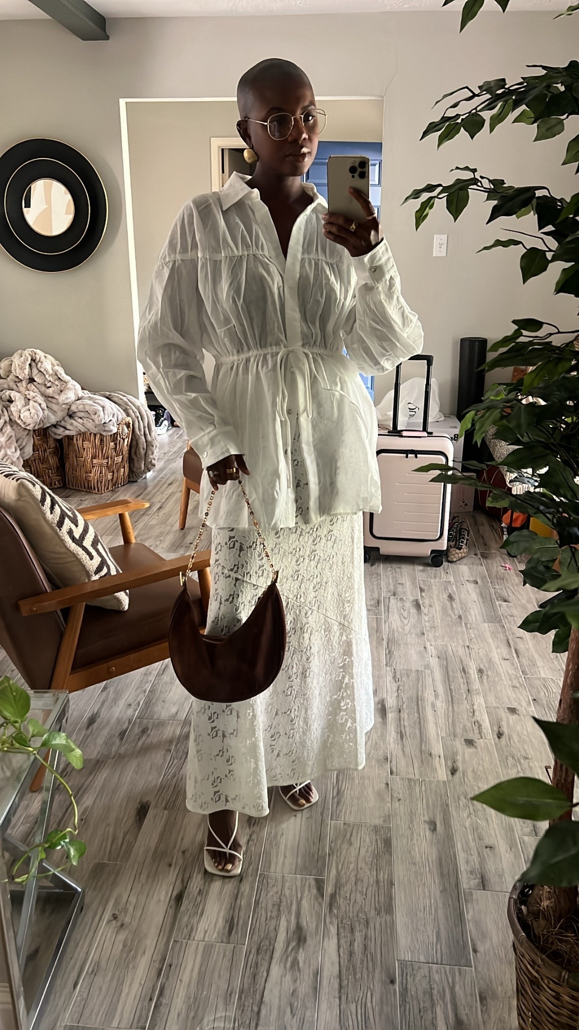 Transitional fall outfit I’m styling for LTK Con! White lace maxi skirt, white oversized white linen long sleeve shirt with front tie, brown suede crescent purse, white strappy heels and gold metal frame blue light glasses. 

#LTKCon