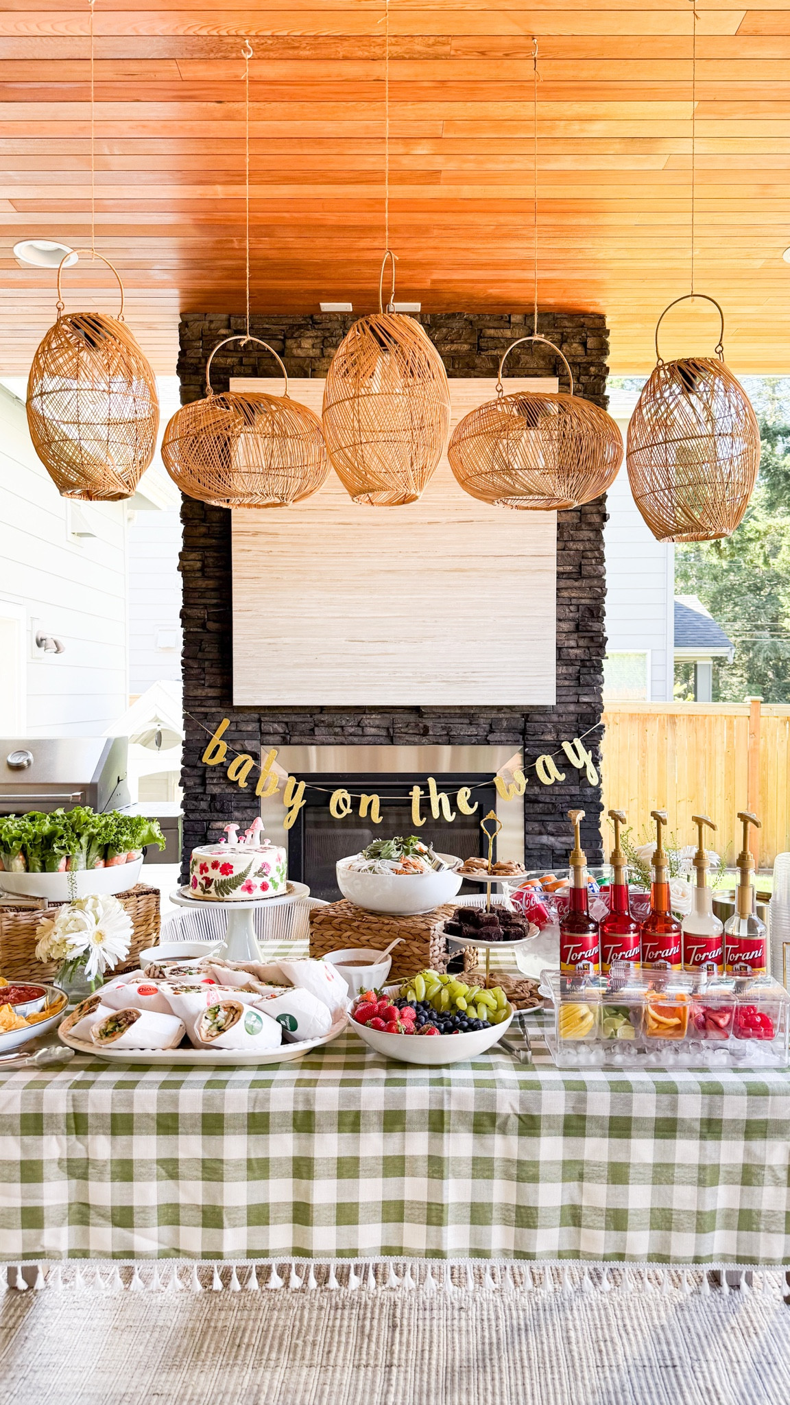 Baby shower food setup! 

Checkered Tablecloth, hanging garland, sprite, coke, beverage tub, pump dispenser, Torani drink syrup soda, dr pepper, plastic cup, cake, dried flowers, bud vases, metal ice bucket 

#LTKParties #LTKHome #LTKSeasonal