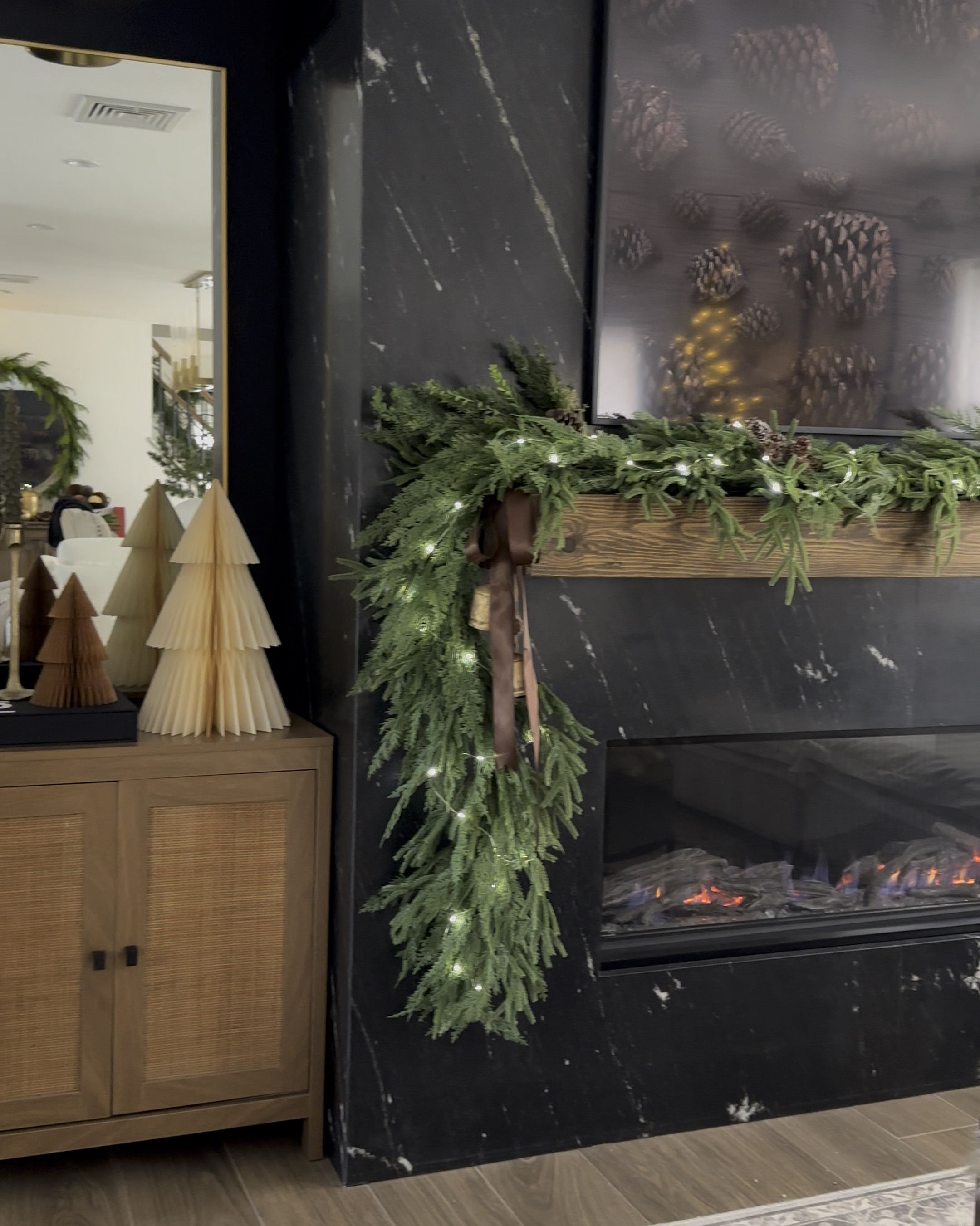 Holiday living room inspo. Cozy living room. Christmas decor. Coffee table decor. Mantle, fireplace, cozy. Frame tv on sale! 

#LTKHome #LTKCyberWeek #LTKHoliday