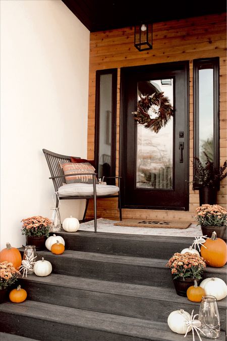 Fall outdoor front porch with outdoor pillows and fall wreath.  I added some skeletons to the space as Halloween decor.  World Market - fall decor - Halloween decor 

#LTKhome #LTKunder50 #LTKHalloween