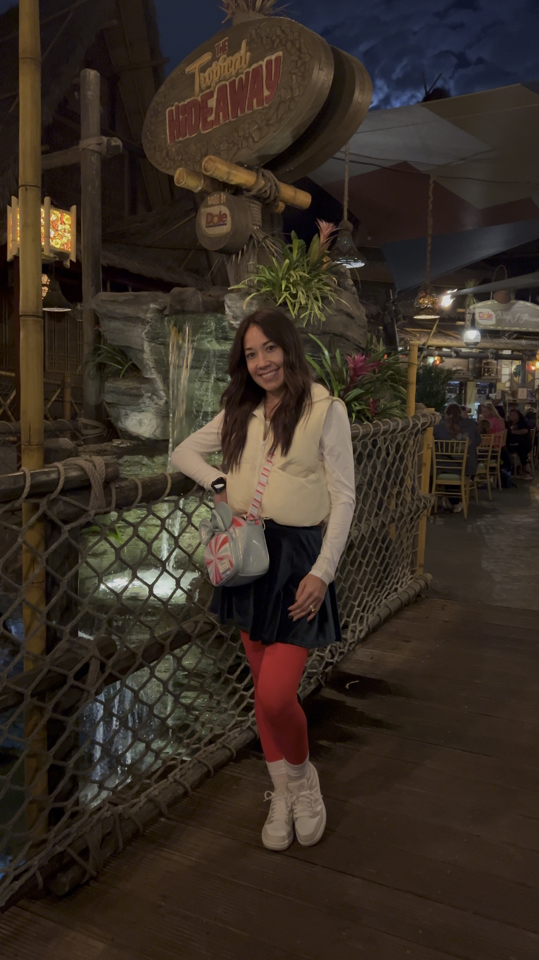 Warm and comfortable at Disneyland for Christmas. Cream puffer crop vest. Dark green high waisted velvet skirt. White long sleep crop top. Red jumpsuit  

#LTKTravel #LTKSeasonal #LTKHoliday