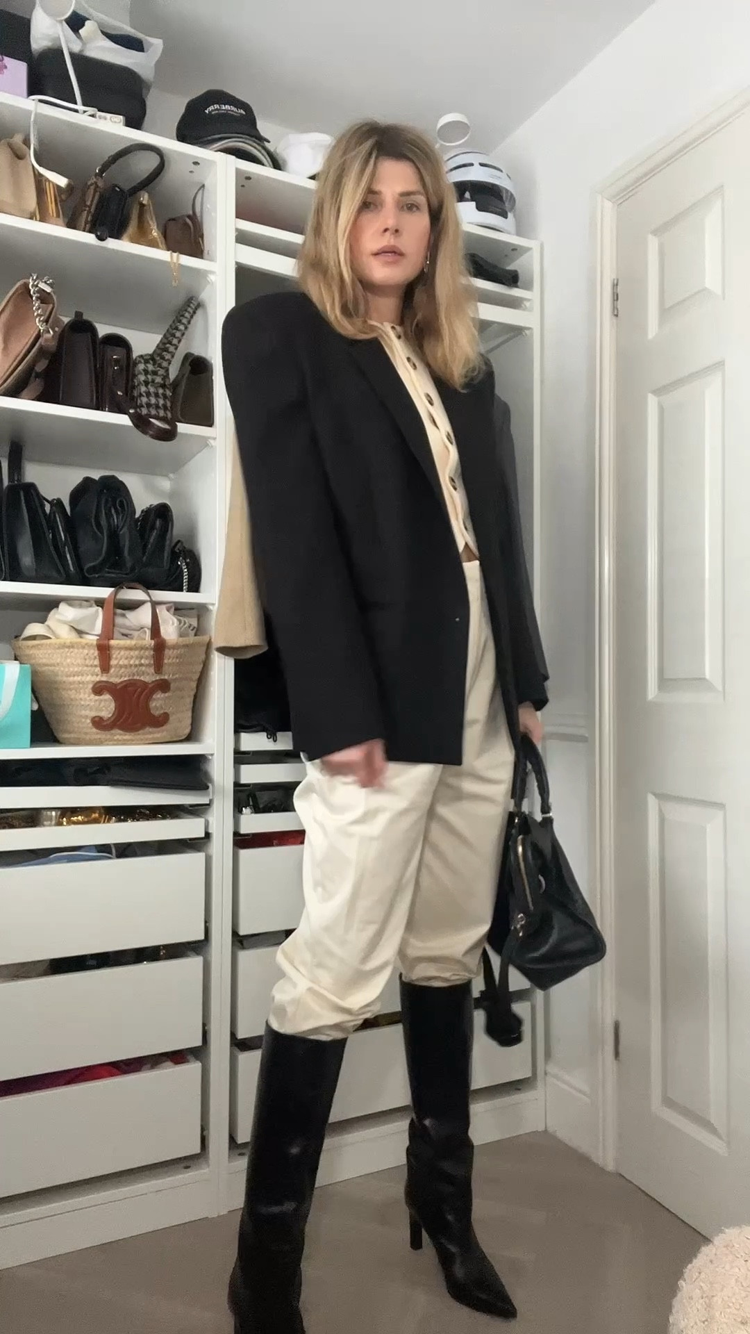 Cream trousers, balenciaga bag, knee high boots, black boots, cream cardigan 

#LTKwinter #LTKeurope #LTKover50style