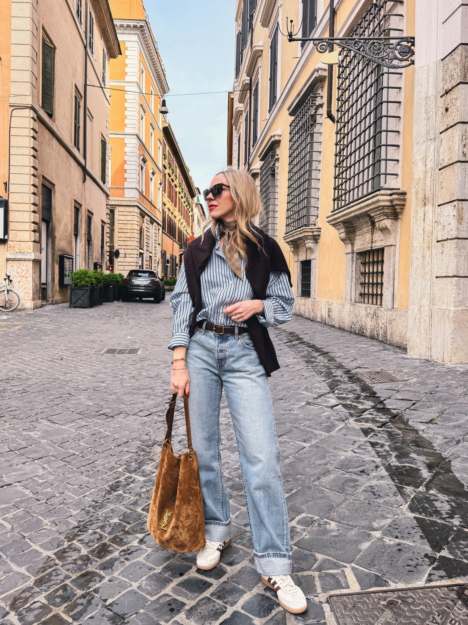 Spring outfit, European travel look, @Zara striped shirt, @Levi's cuffed baggy 90’s jeans, Adidas Samba sneakers, suede YSL bucket bag

#LTKTravel #LTKSaleAlert #LTKSeasonal