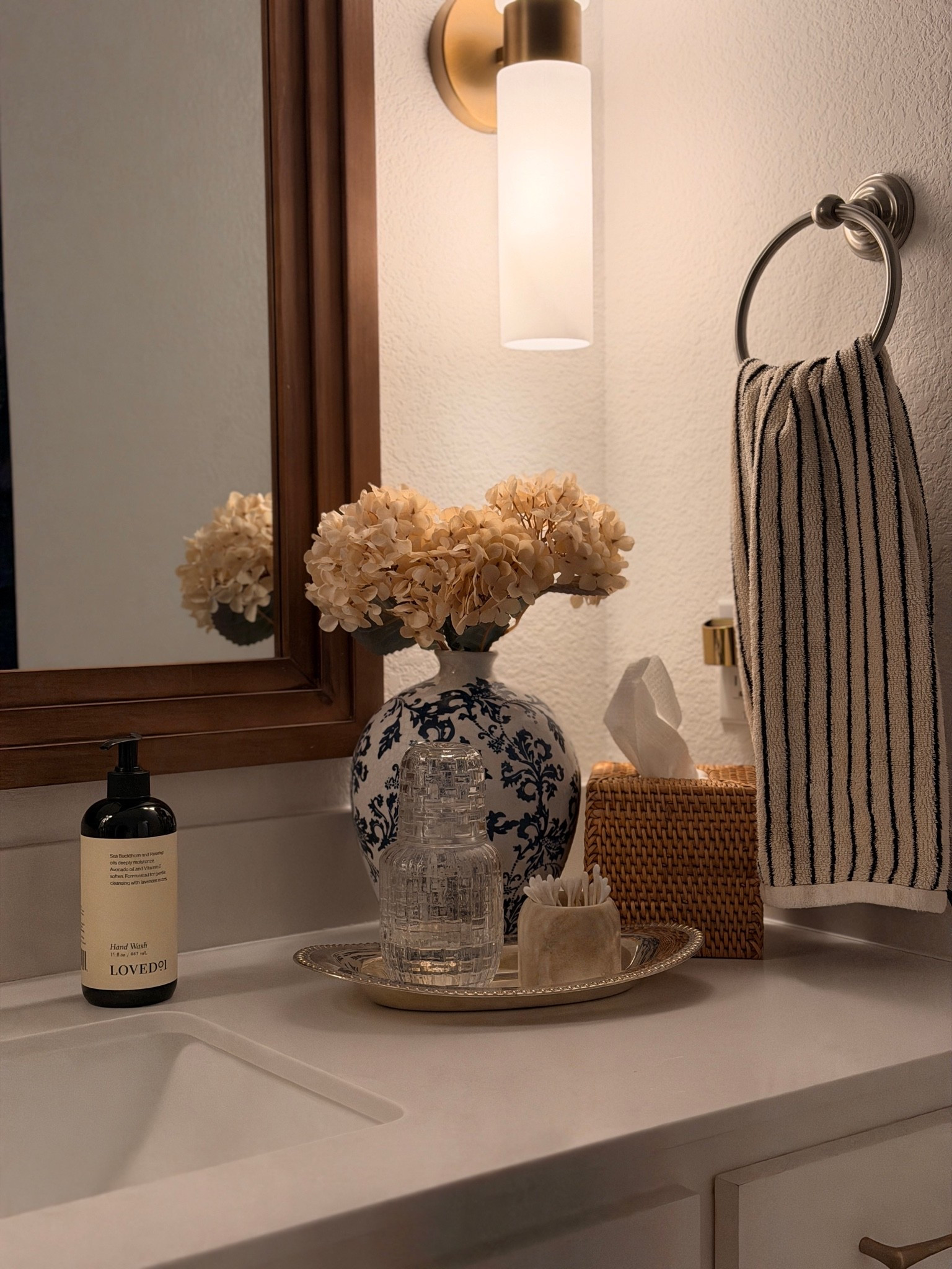 I love adding functional pieces that don’t immediately scream “bathroom”

Storage, makeup wipes, vase, decanter, mouthwash, towel, silver plate, mirror, bathroom, faux floral

#LTKHome #LTKmomlife