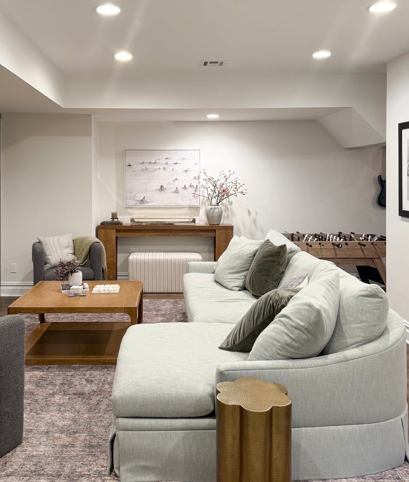 This rug was exactly what this space needed to make it feel warmer and more inviting. The softly distressed pattern adds depth beneath the sectional, while the muted taupe and mauve tones tie in beautifully with the warm wood and olive accents.

living room area rug, neutral patterned rug, distressed area rug, muted vintage rug, sectional rug, family room decor, basement living room, warm neutral interiors, traditional area rug, cozy living room, girlonthehudson

#LTKHome #LTKSeasonal