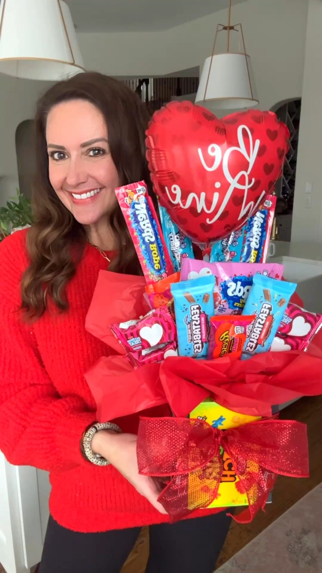 Easy DIY candy bouquet! Use candy of your choice!! 
I used:
4 boxes of sour patch kids
4 Nerd ropes
1 bag of Nerd Clusters
2 Feastable bars
Reese's hearts 
Mini rice krispie squares
A foam block cut in half (linked below!)
Tape and a hot glue gun
Red tissue paper
Ribbon 
Valentine balloon
Directions:
Hot glue the 4 boxes of candy to create a vase. 
Cut your foam block to size and place it in the middle. 
Tape your candy of choice to dowel rods
Arrange your candy and balloon, sticking the rods into the foam to secure them. 
Add tissue paper to the gaps at the bottom.
Tie ribbon around the vase (optional) 
.


#LTKValentine #LTKKids #LTKSeasonal