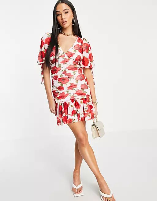 ASOS DESIGN puff sleeve ruched pep hem skater mini dress in floral print | ASOS (Global)